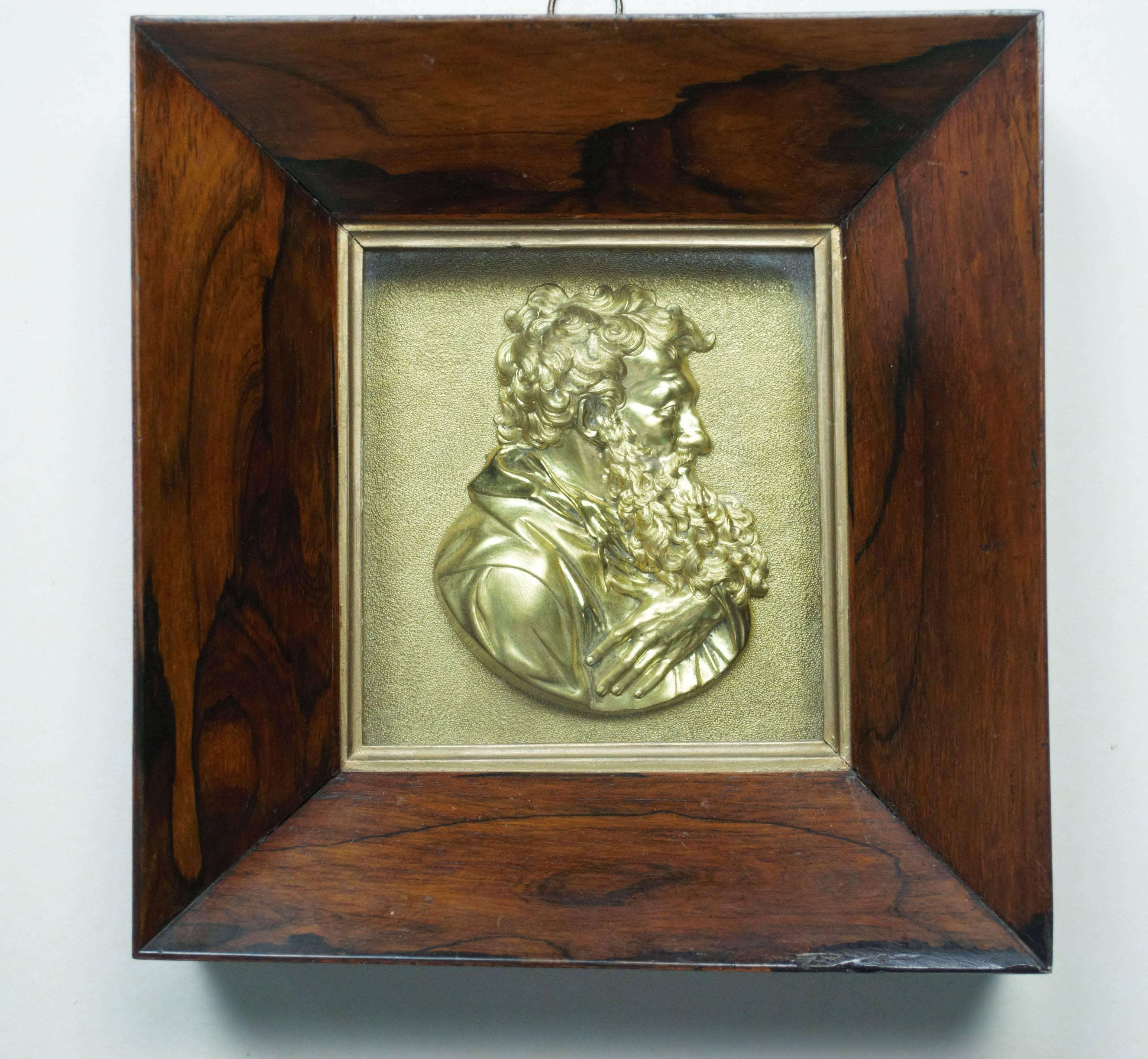 An unusual pair of gilded bronze profile bust portraits of unknown philosophers or scholars (possibly St Peter and St Paul), mounted in original deep rosewood frames. The cast and polished busts set on a textured matte background, in good original