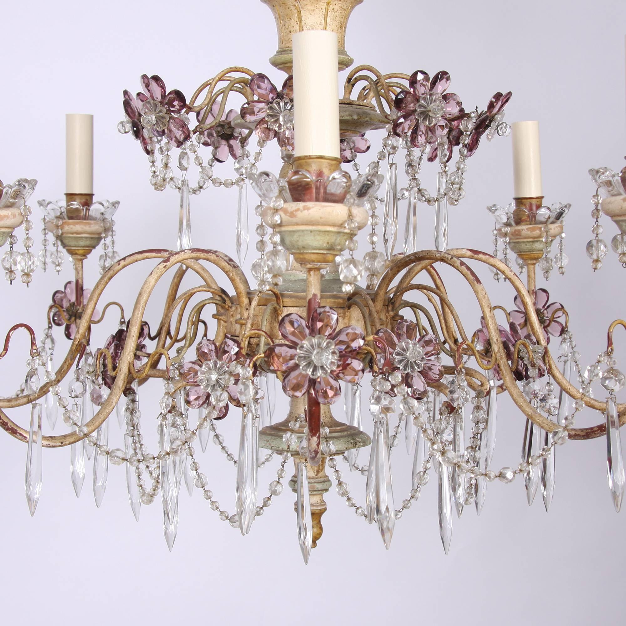 Beautiful chandelier painted cream and pale green, with eight arms. Painted carved wood column, with painted metal arms. Beautiful icicle drops with amethyst colored glass flowers. Original ceiling rose. Fully re-wired.