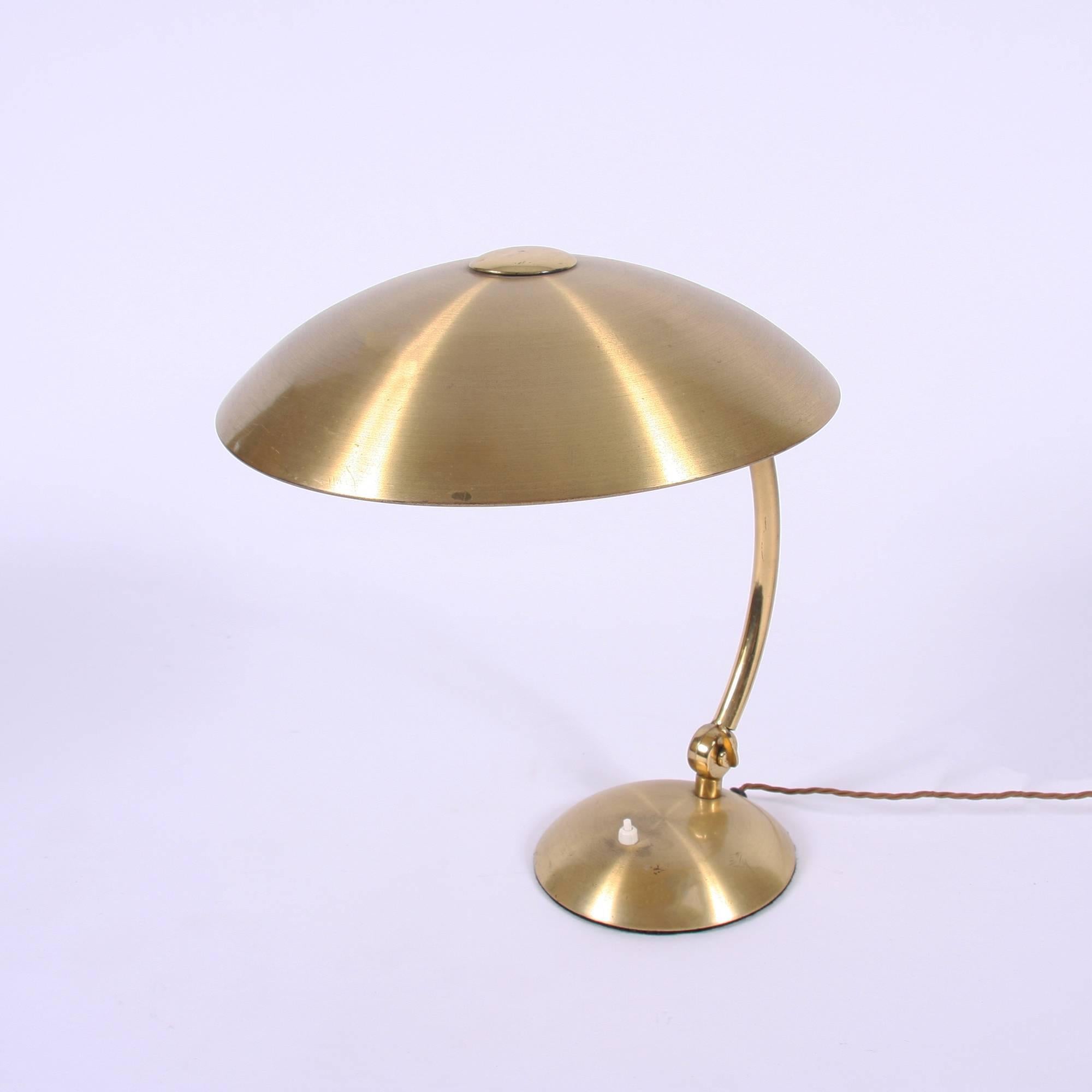A stunning Mid-Century French brass lamp with a 'mushroom' shade also in brass. Adjustable angles and fully re-wired.