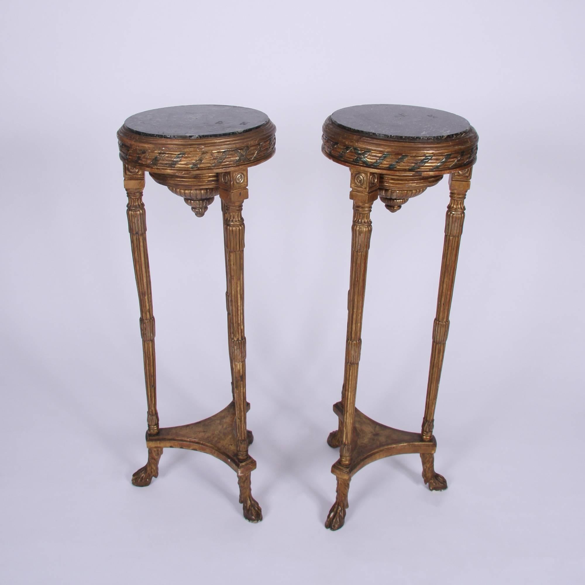 Pair of giltwood torcheres

French, 1920 

With marble top.