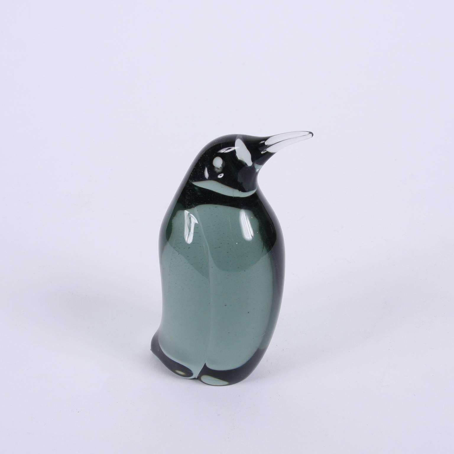 Swedish, circa 1960.

A sweet small decorative studio glass penguin in a transparent dark green or grey. This is a stunning small decorative piece in fantastic condition.