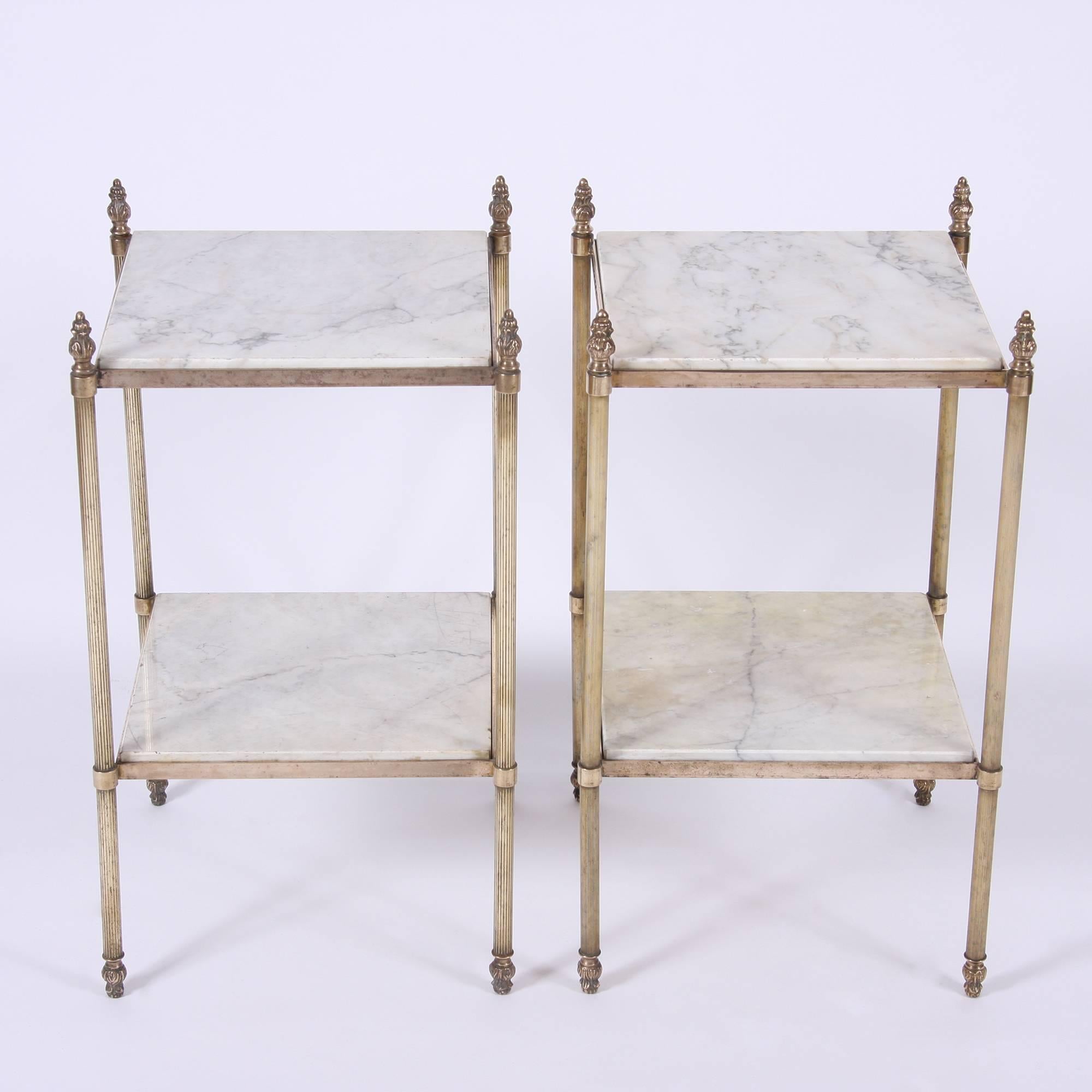 French, circa 1950

A lovely pair of brass side tables with twisted legs and decorative finials. Two-tiered with white and grey marble.