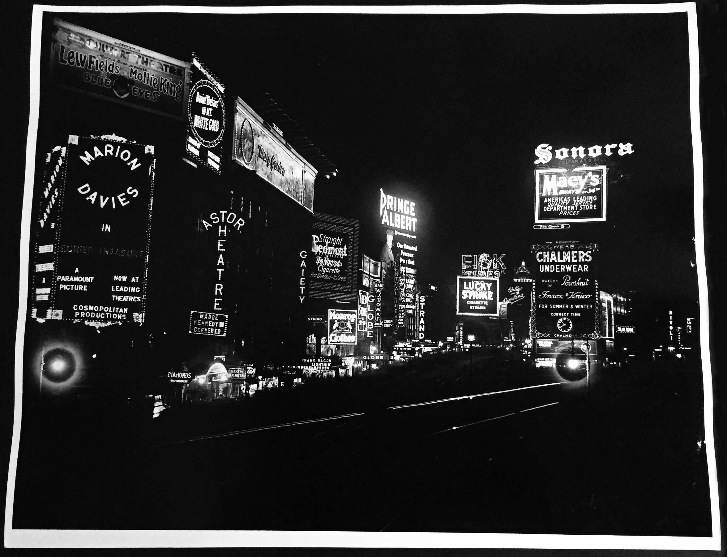 Time Square at night photographed, circa mid-1930s
Vintage original gelatin silver print, printed circa late 1950s

Measures: 16 x 20 inches 
Unsigned from unknown photographer
Very good condition with the exception of some waving on edges