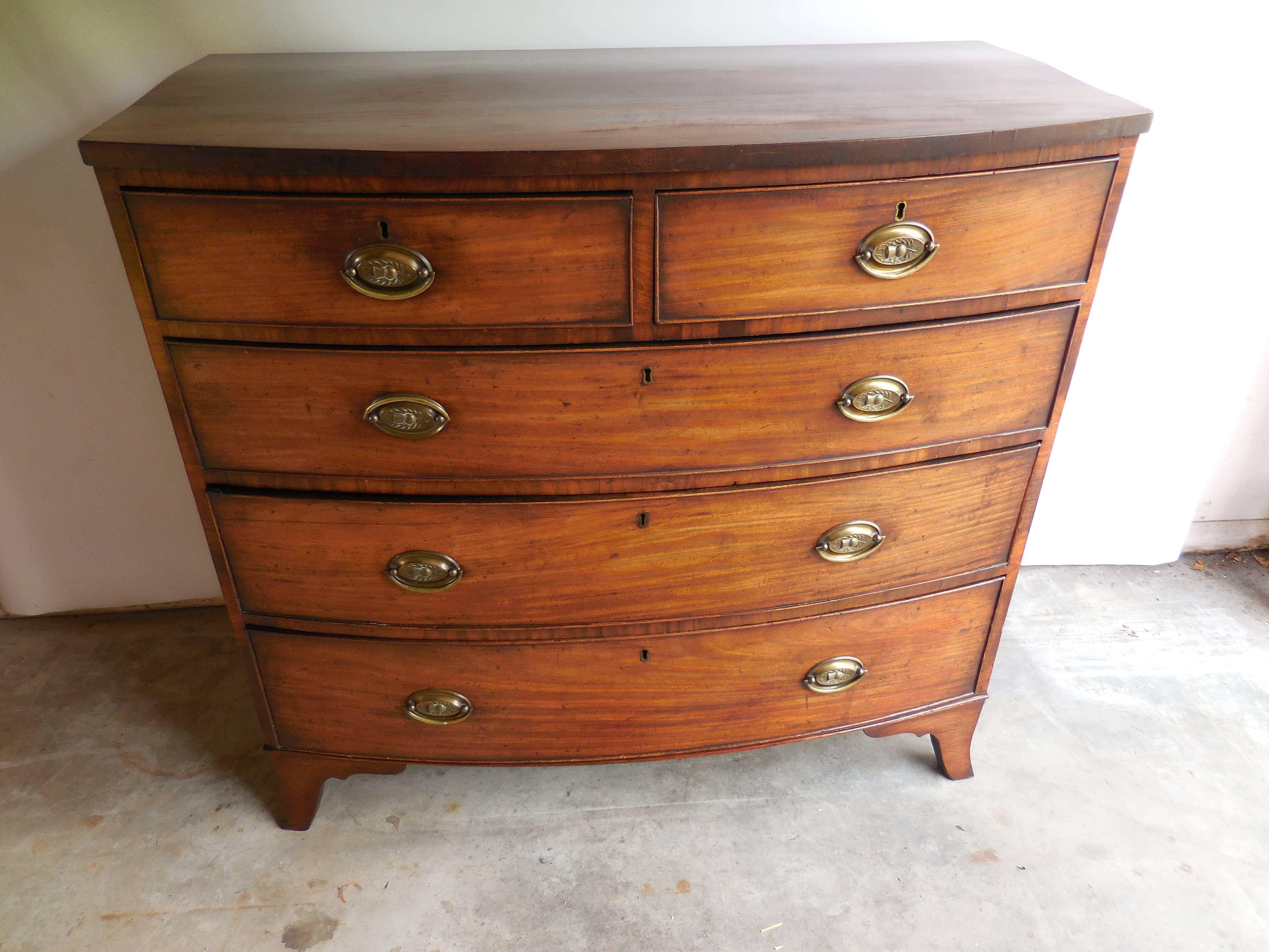 19th century English five drawer chest with brass handles. One crack on top consistent with age.