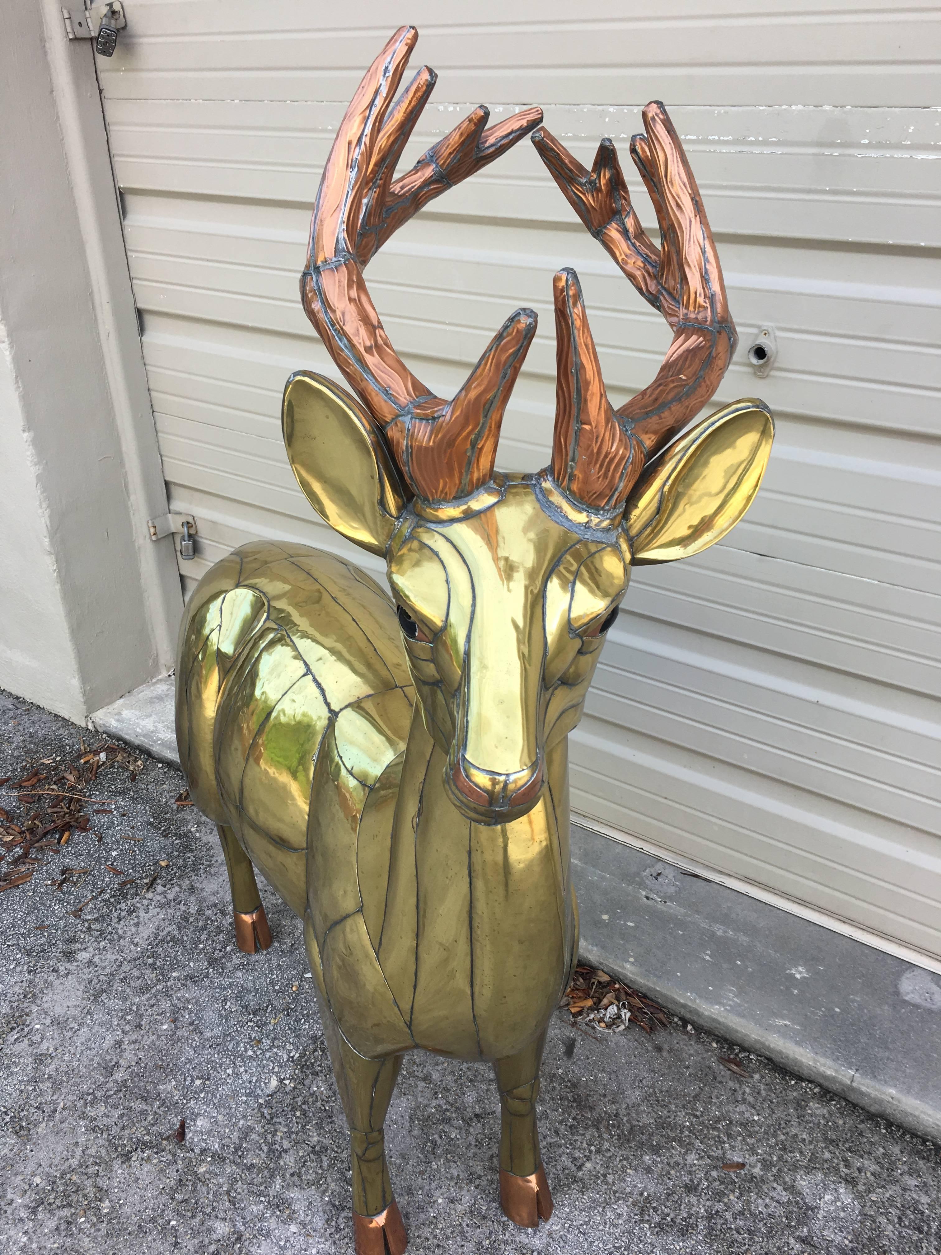 Beautiful brass and bronze deer sculpture by Sergio Bustamante, circa 1970. In excellent condition.
