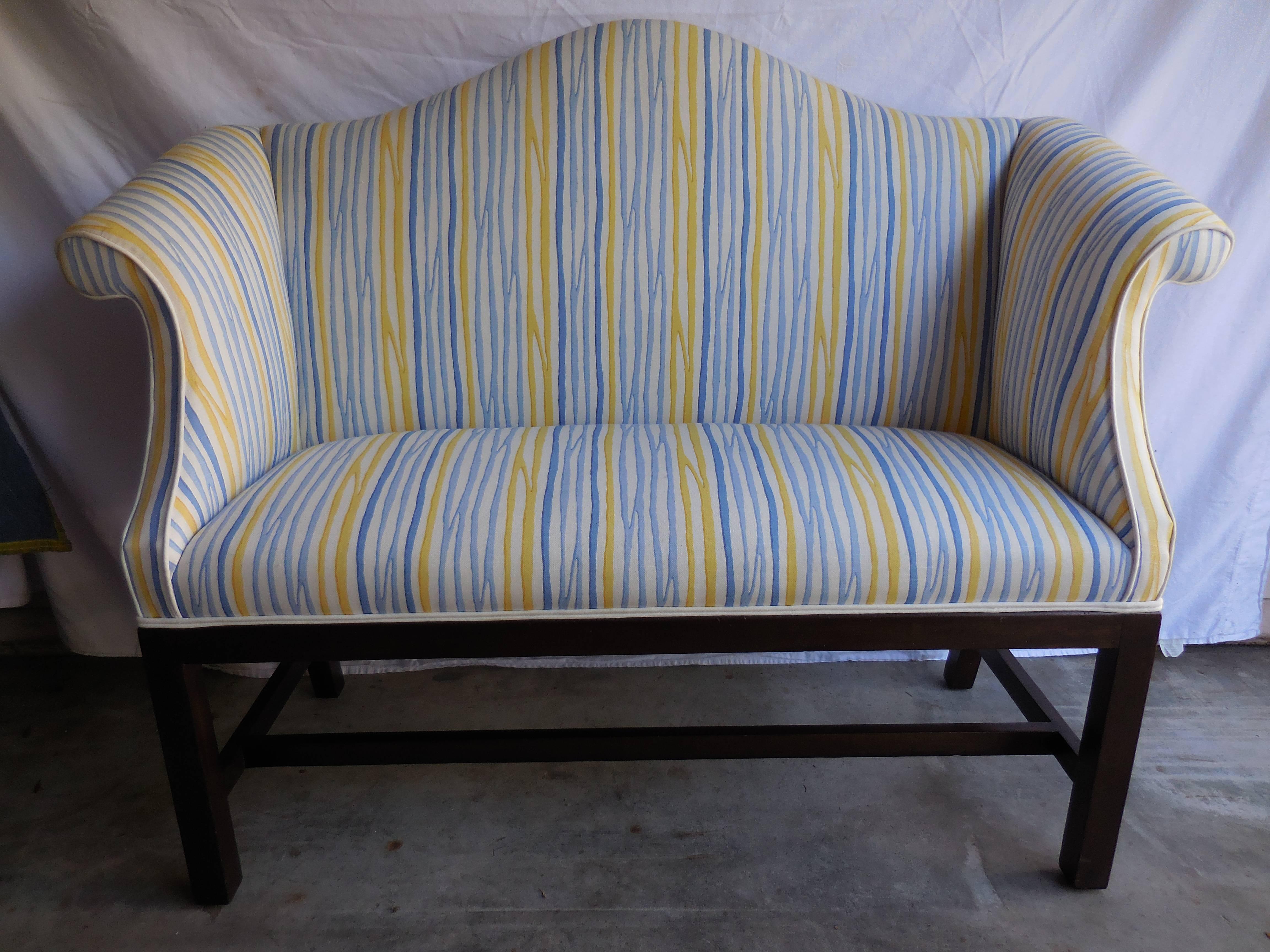 Small contemporary camelback settee re-upholstered in a gorgeous blue, white and yellow fabric. Great for an entry or foot of the bed.