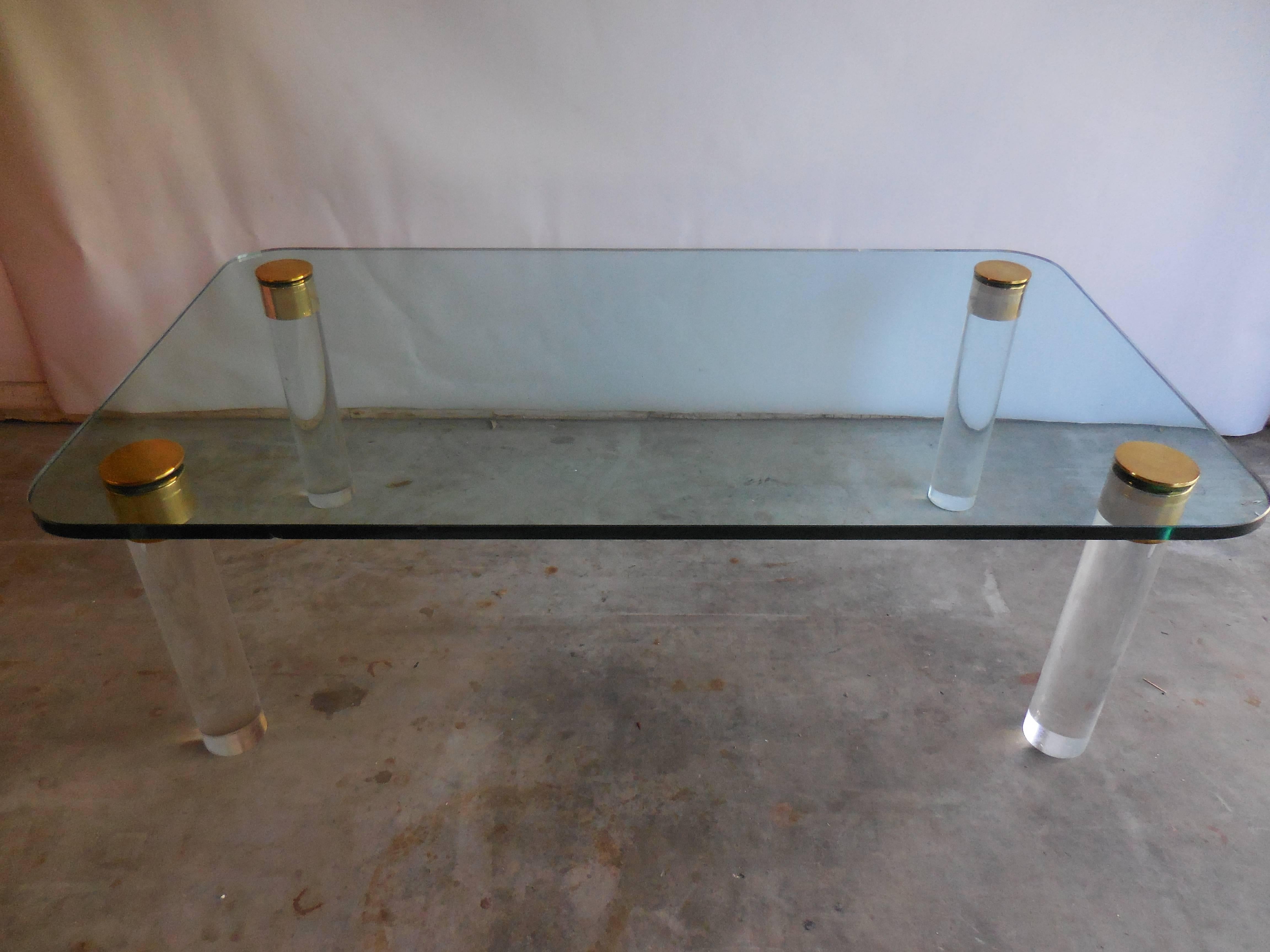 1970s glass and Lucite coffee table with brass caps by Pace Collection. One chip on the edge of glass.