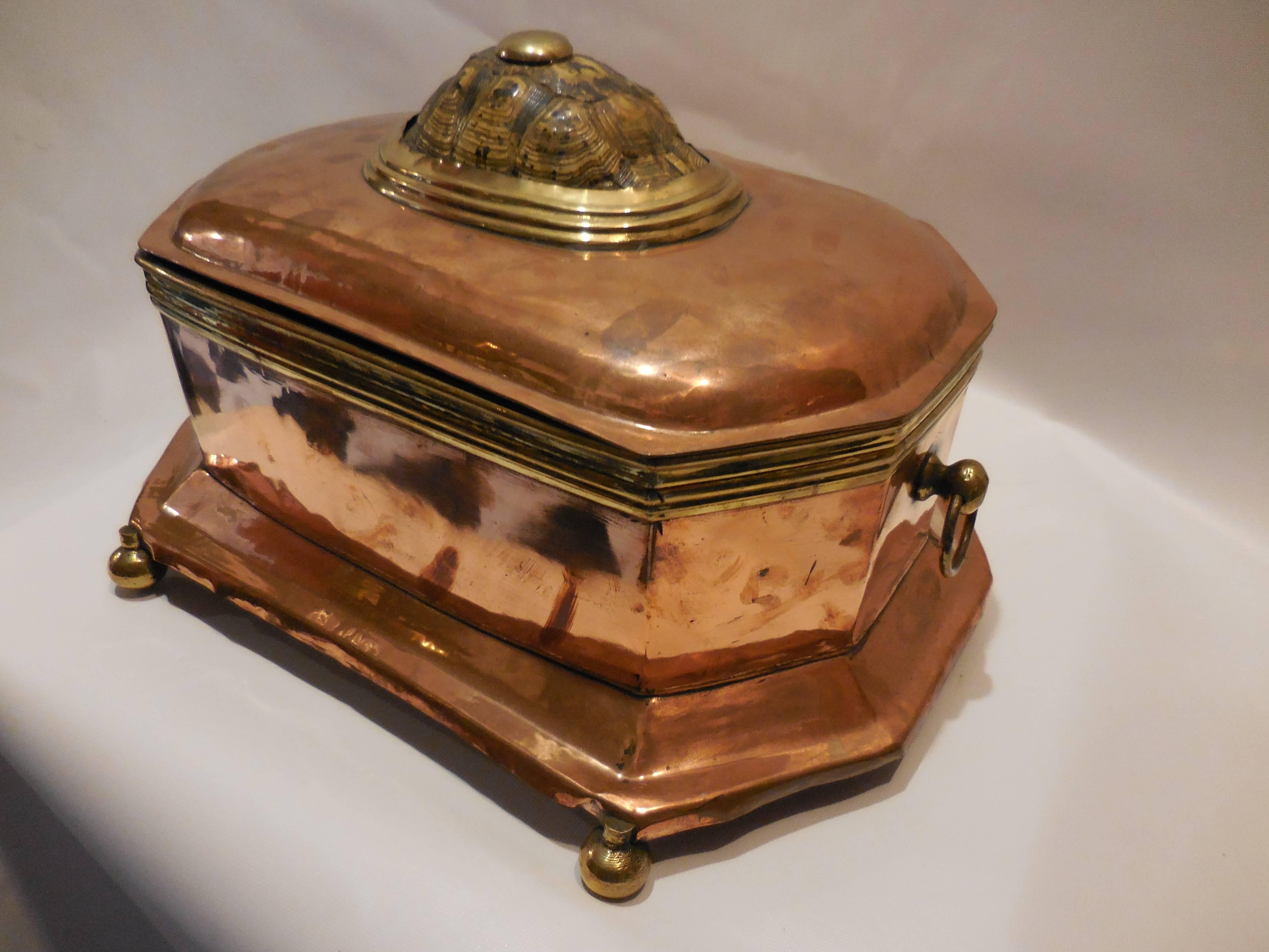 19th century copper and brass casket topped with tortoise shell.