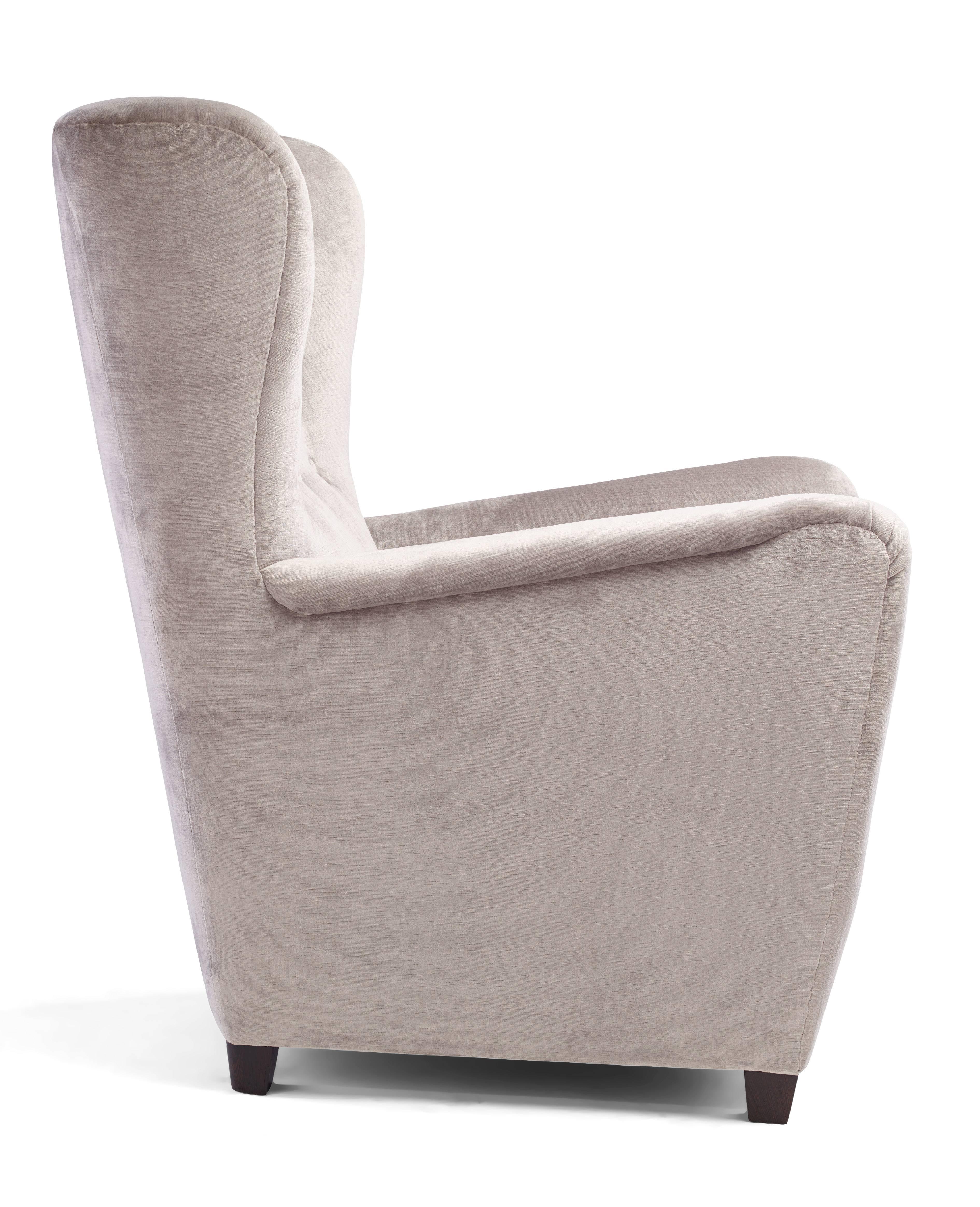 The 1942 armchair represents the finest in handmade custom upholstered furniture. Based heavily on a 1942 Danish design, a number of details have been reworked and updated to make the chair both more stylish, and more comfortable for today's