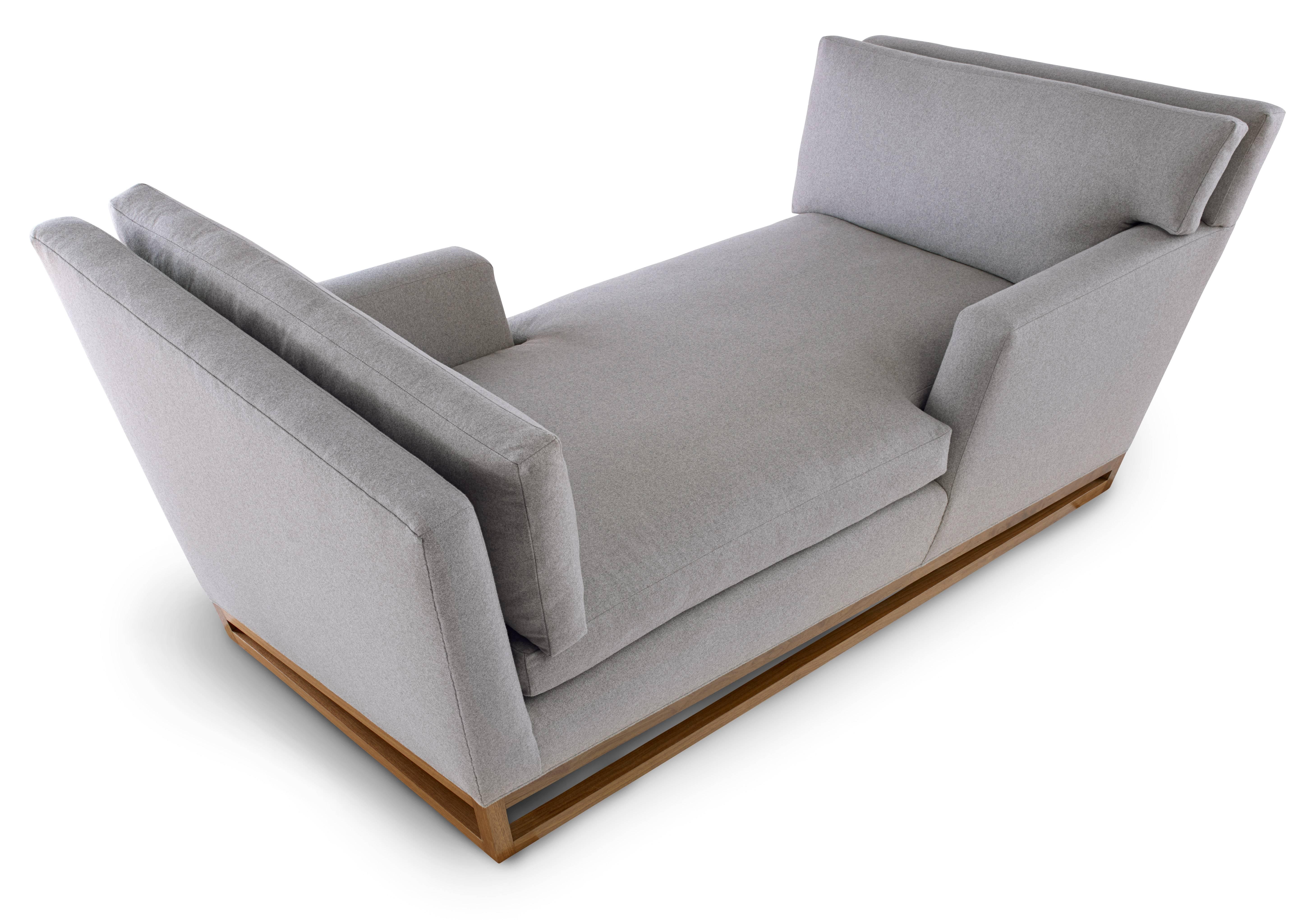 This handmade, contemporary Angle Base Tête-A-Tête sofa is sure to be the centrepiece of any room. The unique angular base of this all-original design sets off the angular form vocabulary seen throughout. But don't let the hard angles fool you,