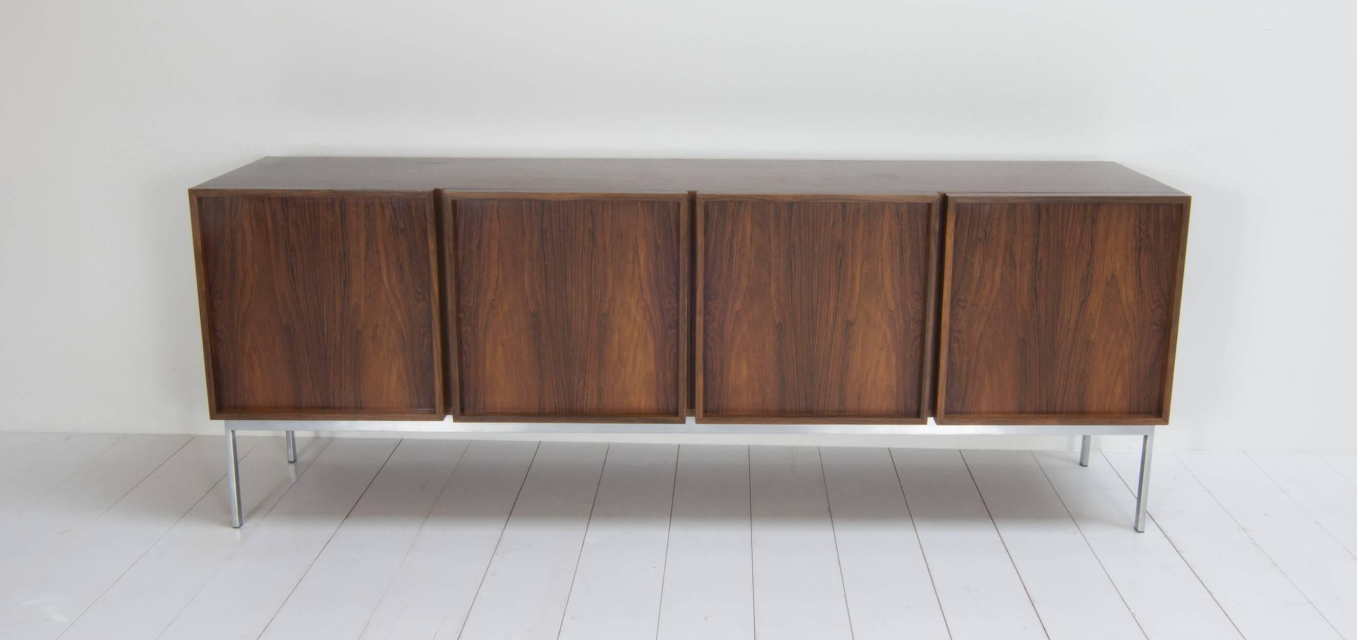 Renz sideboard designed by Walter Wirz in the 1960s. The Renz sideboard is produced by Wilhelm Renz in Germany. The outside of this dresser is made of rosewood, the inside of oak and the chassis is made of chromed steel.

Renz sideboard; modern and