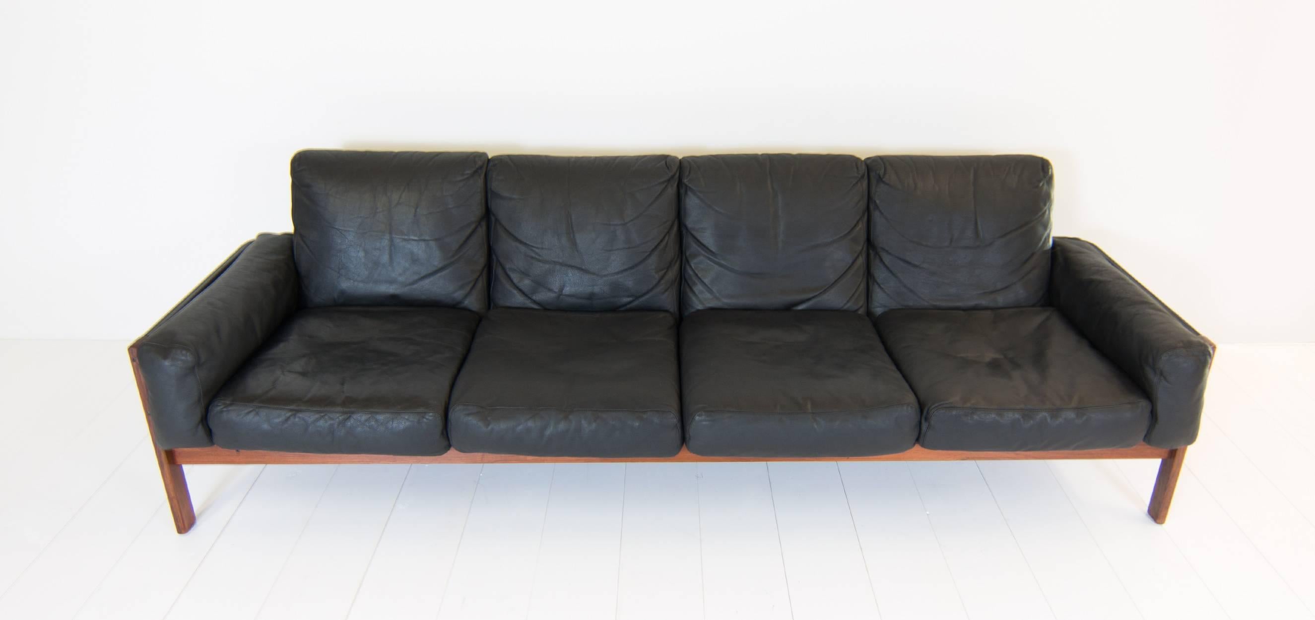 Sven Ivar Dysthe four-seat is produced by Dokka Møbler in Oslo. The sofa is designed in Norway in the 1960s. The frame is made from rosewood and is upholstered in black leather. The cushions are filled with down feathers.

The condition of this