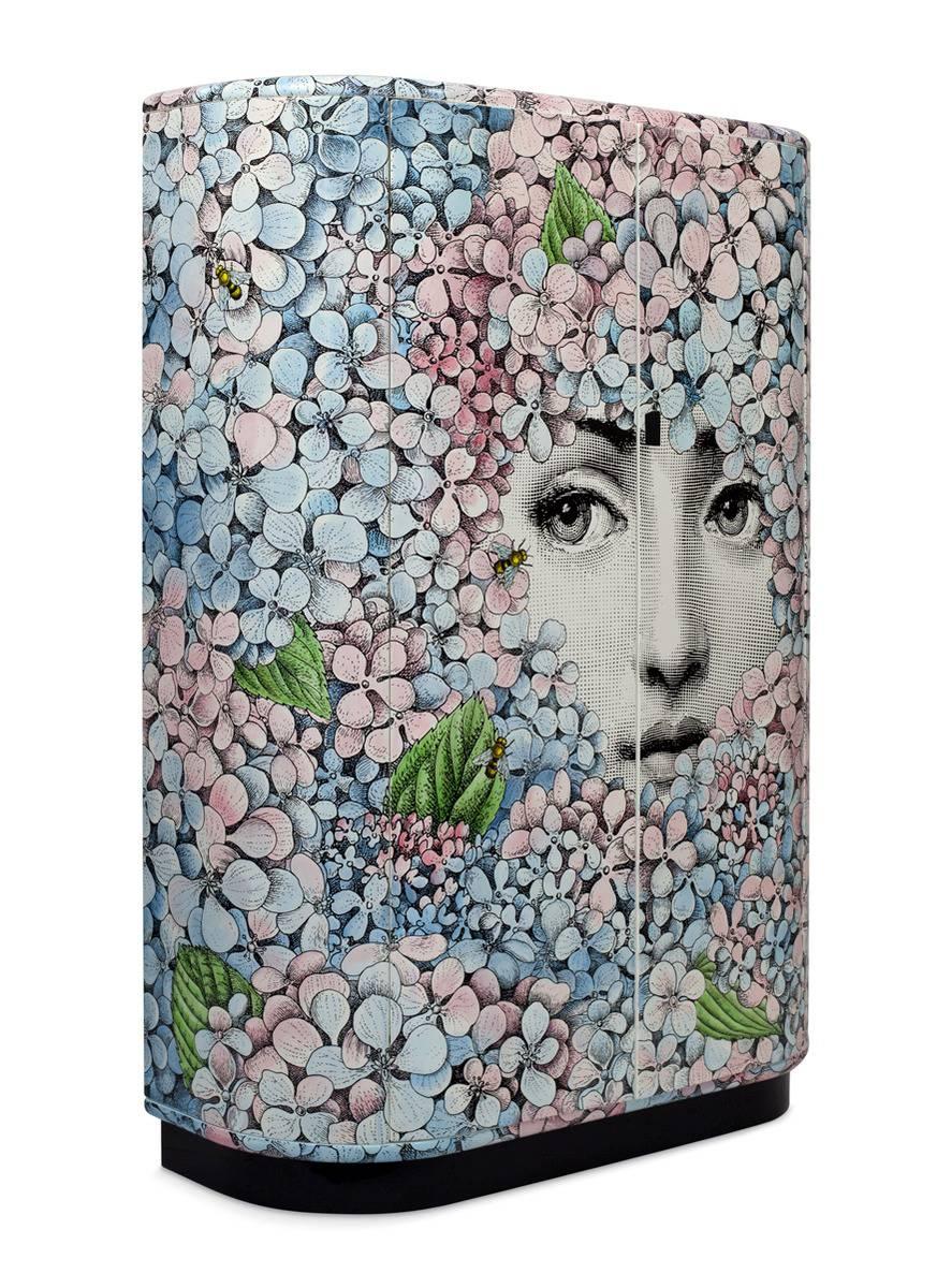 This cabinet is hand painted, 5 of 20 made in 2015.

The Italian artist and illustrator Piero Fornasetti was one of the wittiest and most imaginative design talents of the 20th century. He crafted an inimitable decorative style from a personal