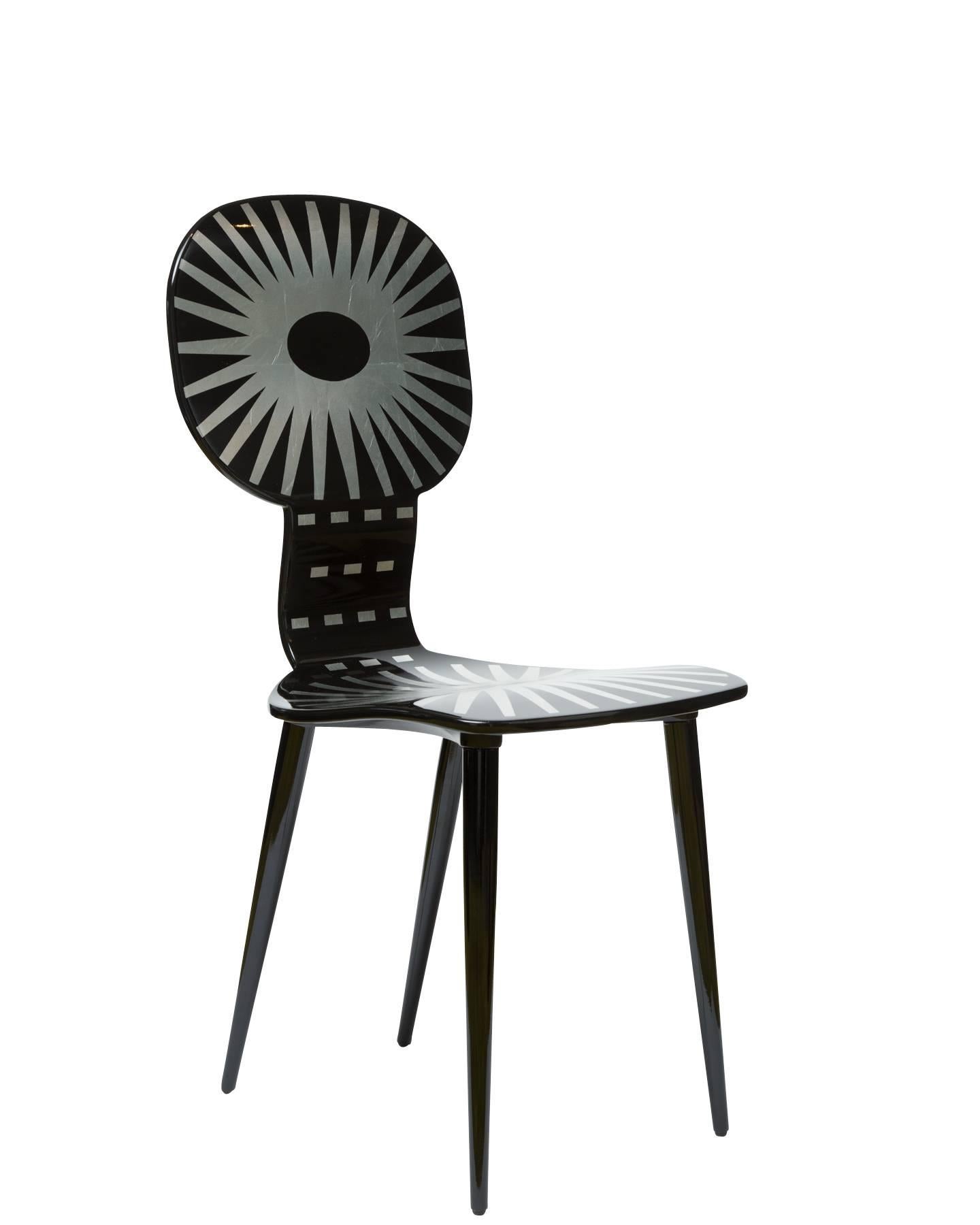 This chair has a lithographically applied graphic which is hand-finished and covered with a smooth lacquer.

4 of 12 made in 2016.

The Italian artist and illustrator Piero Fornasetti was one of the wittiest and most imaginative design talents of