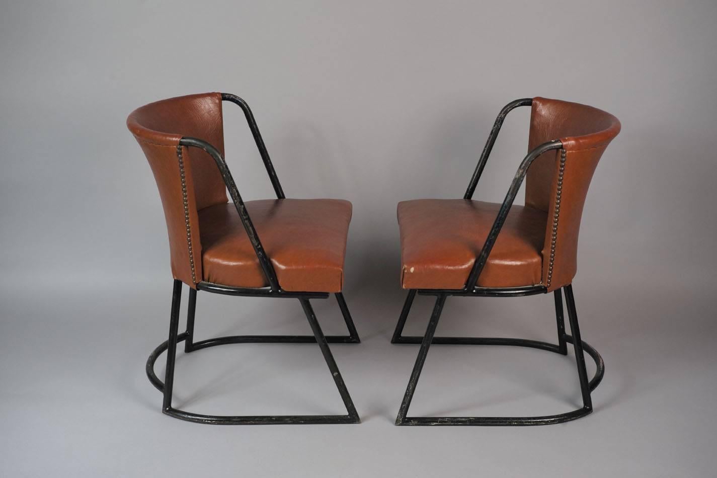 This side chair was designed by Louis Sognot and Charlotte Alix for Primavera in the 1930s. The chair is made from black lacquered tubular metal with studded imitation leather in a cognac shade. It is in a very good vintage condition with some usage
