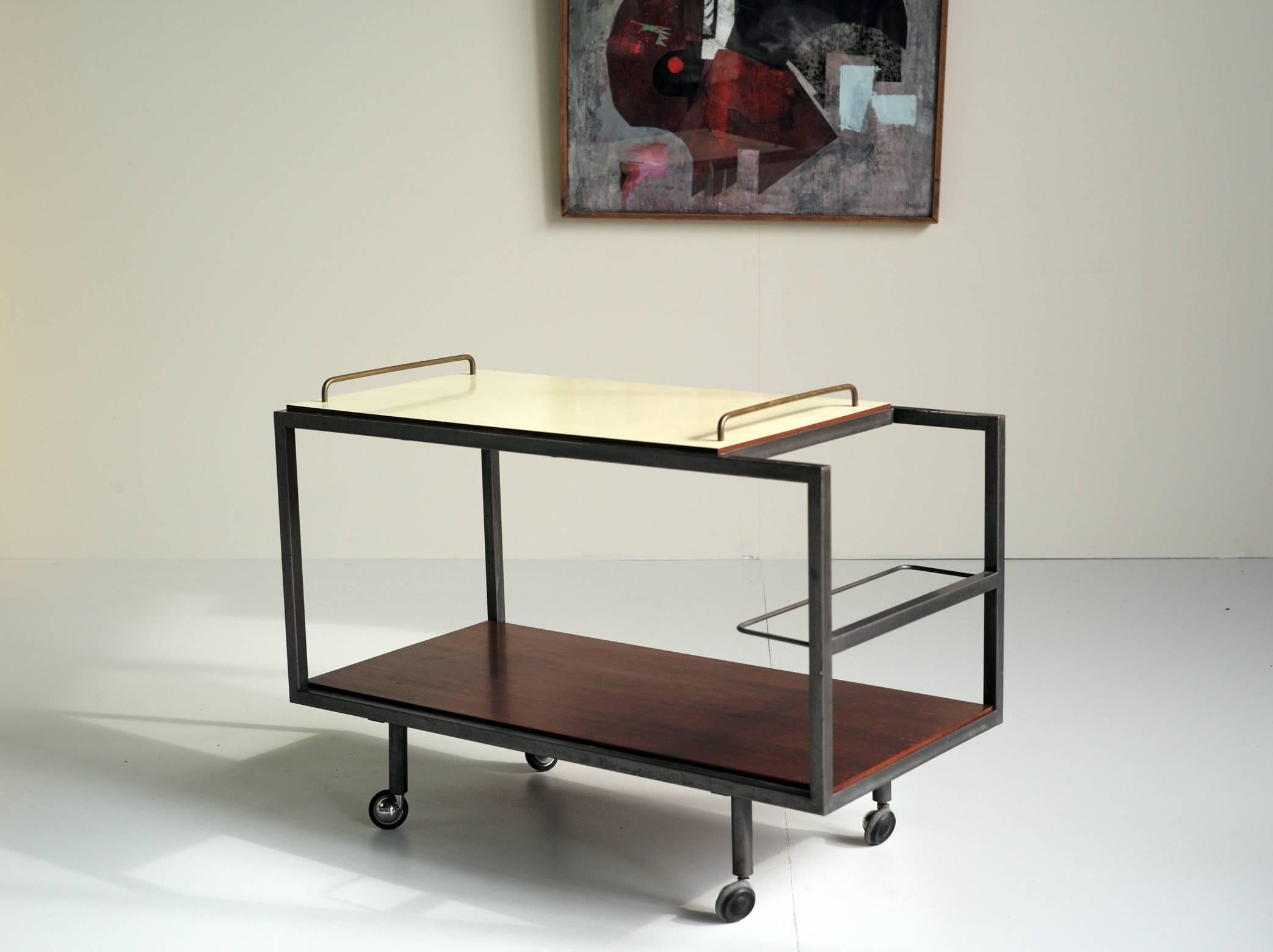 
Bar carts in mahogany and yellow formica of Georges Frydman for E.F.A. / France 1955. The quadrangular structure is out of gray enamelled metal, the higher plate is removable. Very beautiful state.