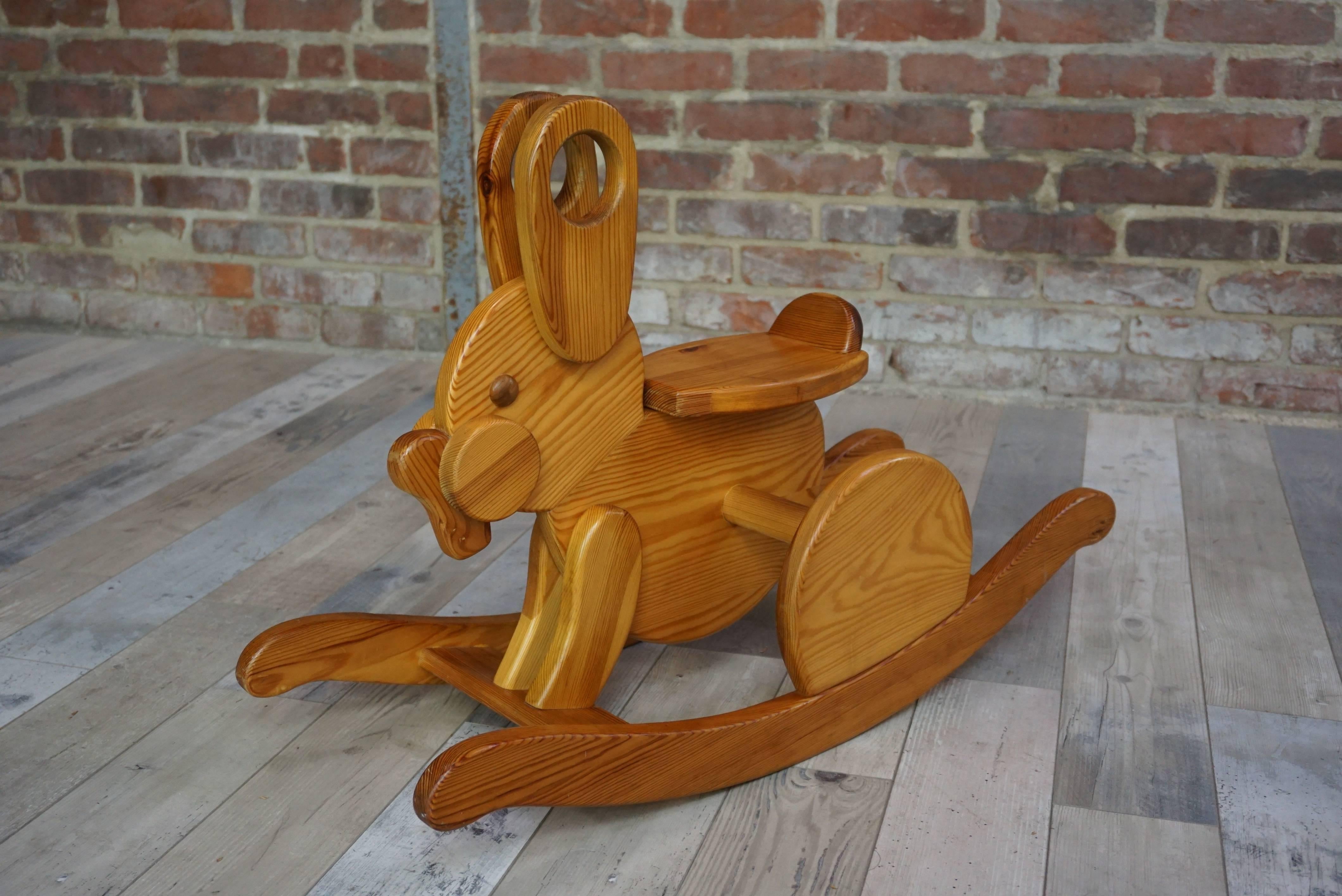 Adorable wooden rocking rabbit made in France.