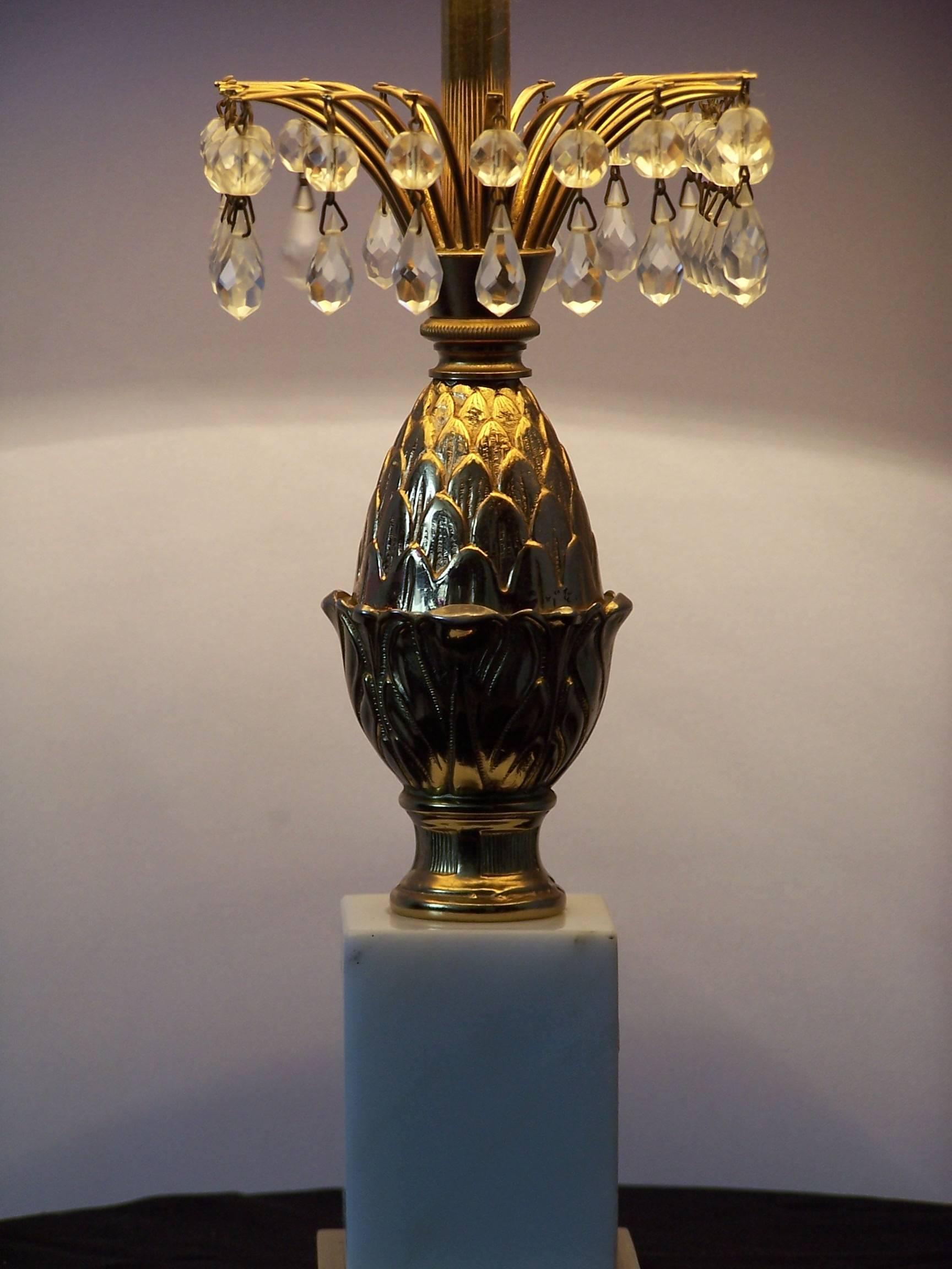This pineapple table lamp features a Carrara marble base and glass pendants.