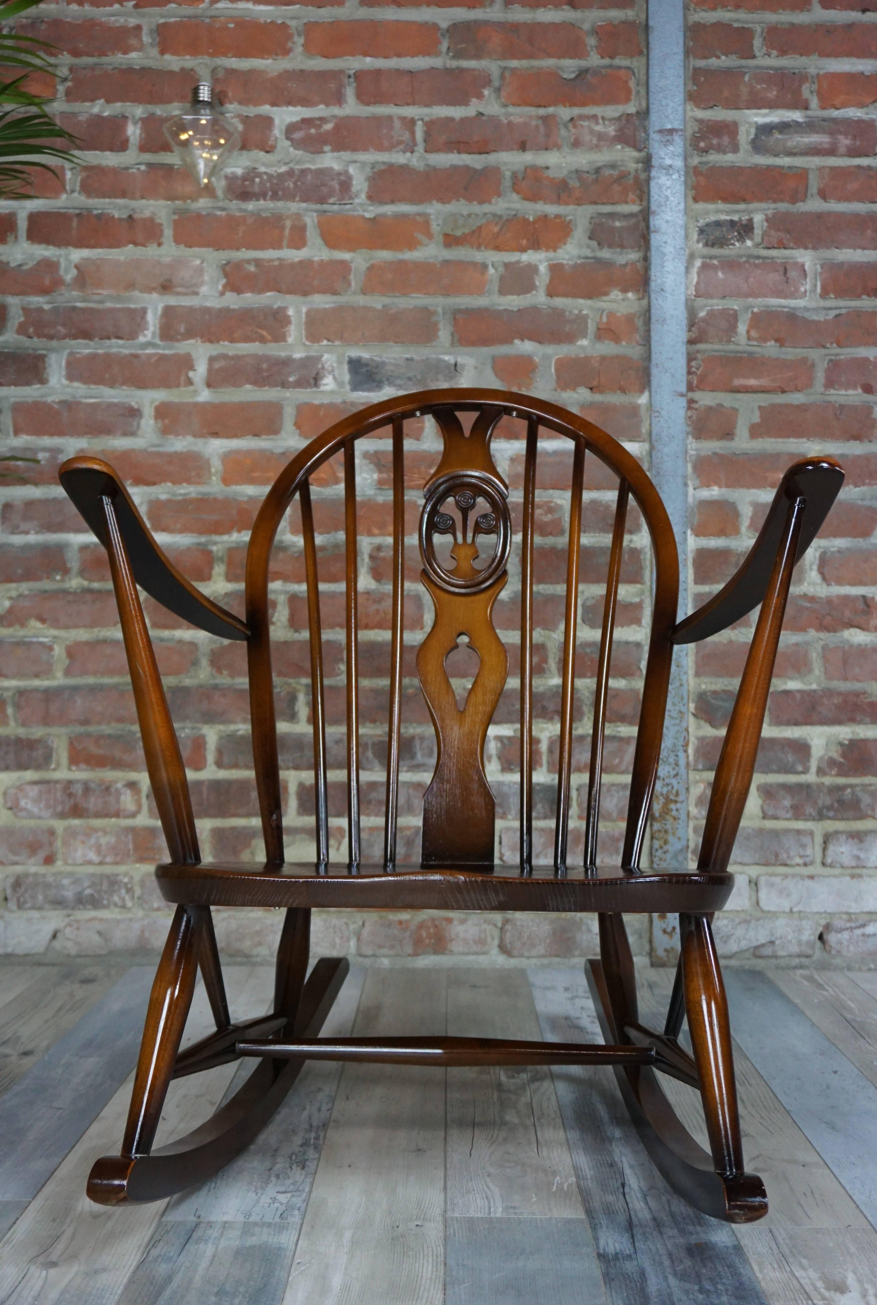 Rocking, solid wood elm from the famous Ercol House (it appears in the catalog of 1956), this model 