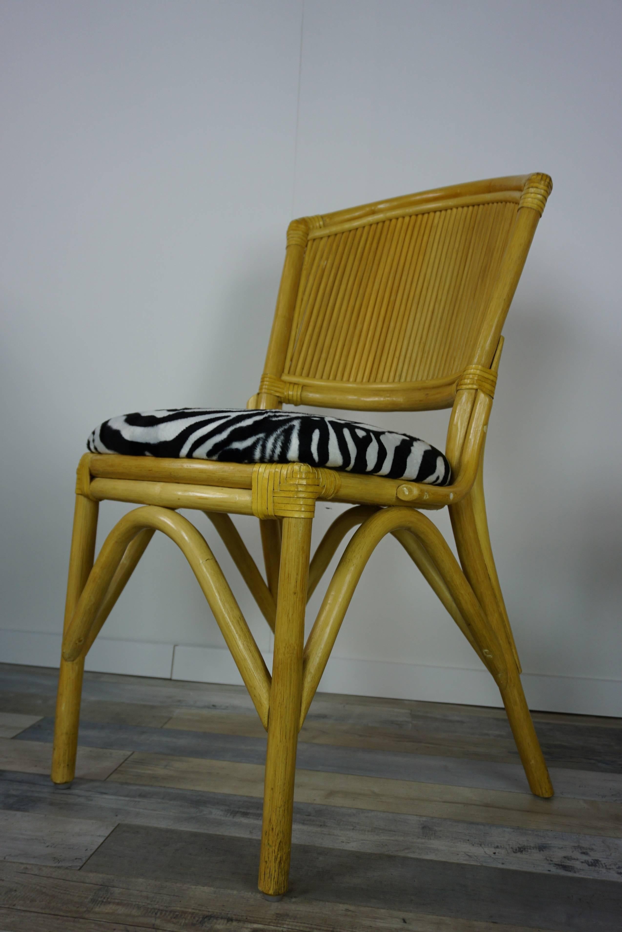 Suite of four rattan chairs and soft and soft seat with velvet zebra skin style upholstered, in very good condition.