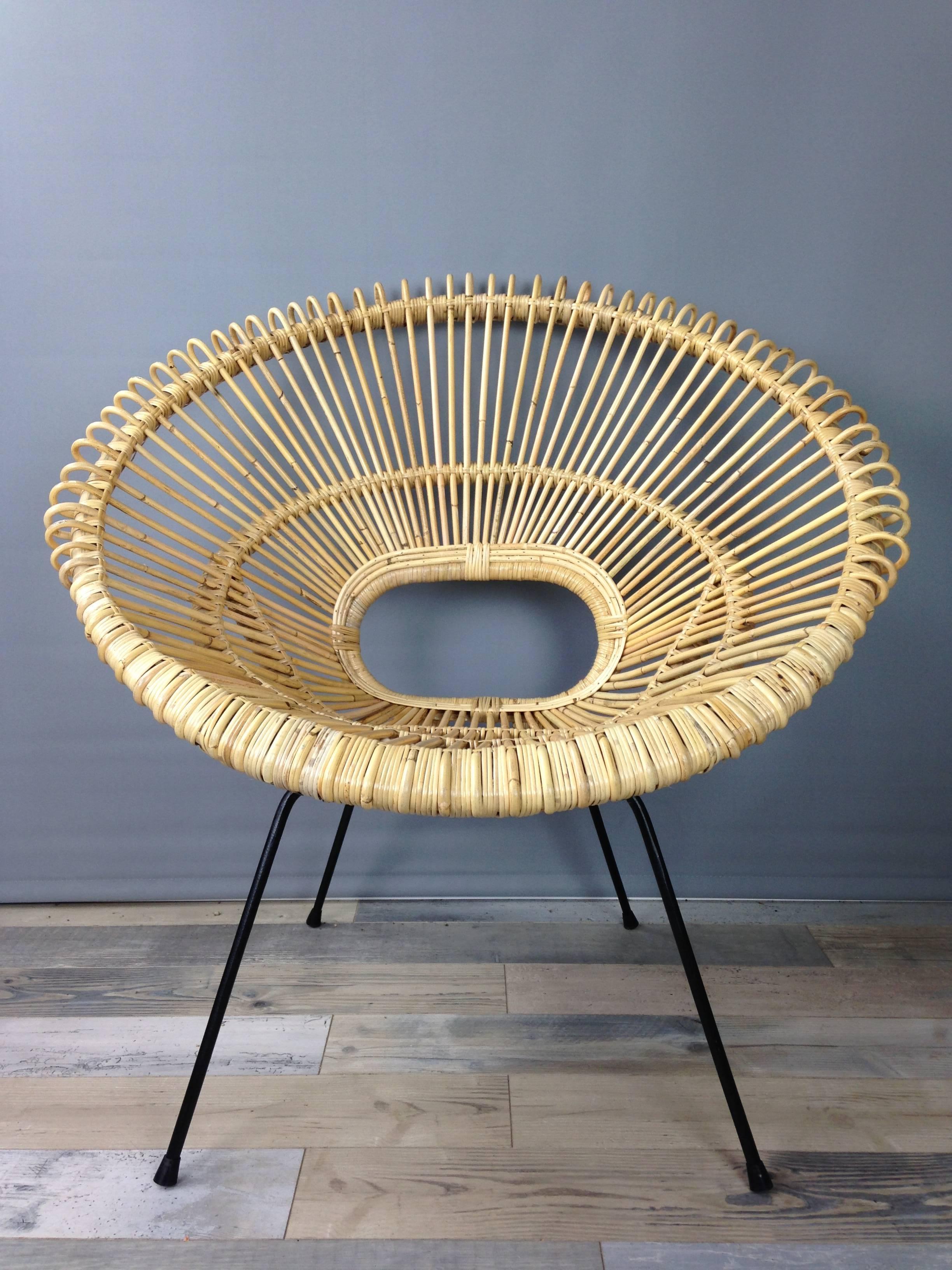 A must-have for any lover of vintage style and natural fiber, this rounded lounge rattan chair made at the manner of Janine Abraham and Dirk Jan Rol is in excellent state ( new item, never used ) 