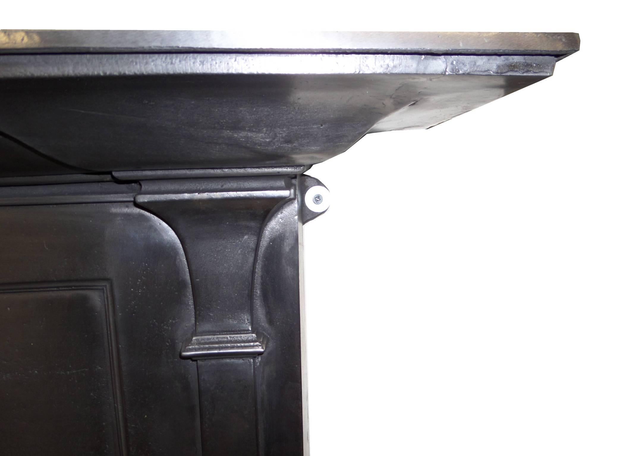 Antique restored Arts and Craft style burnished (semi polished) cast iron surround. Dated at 1916.
 