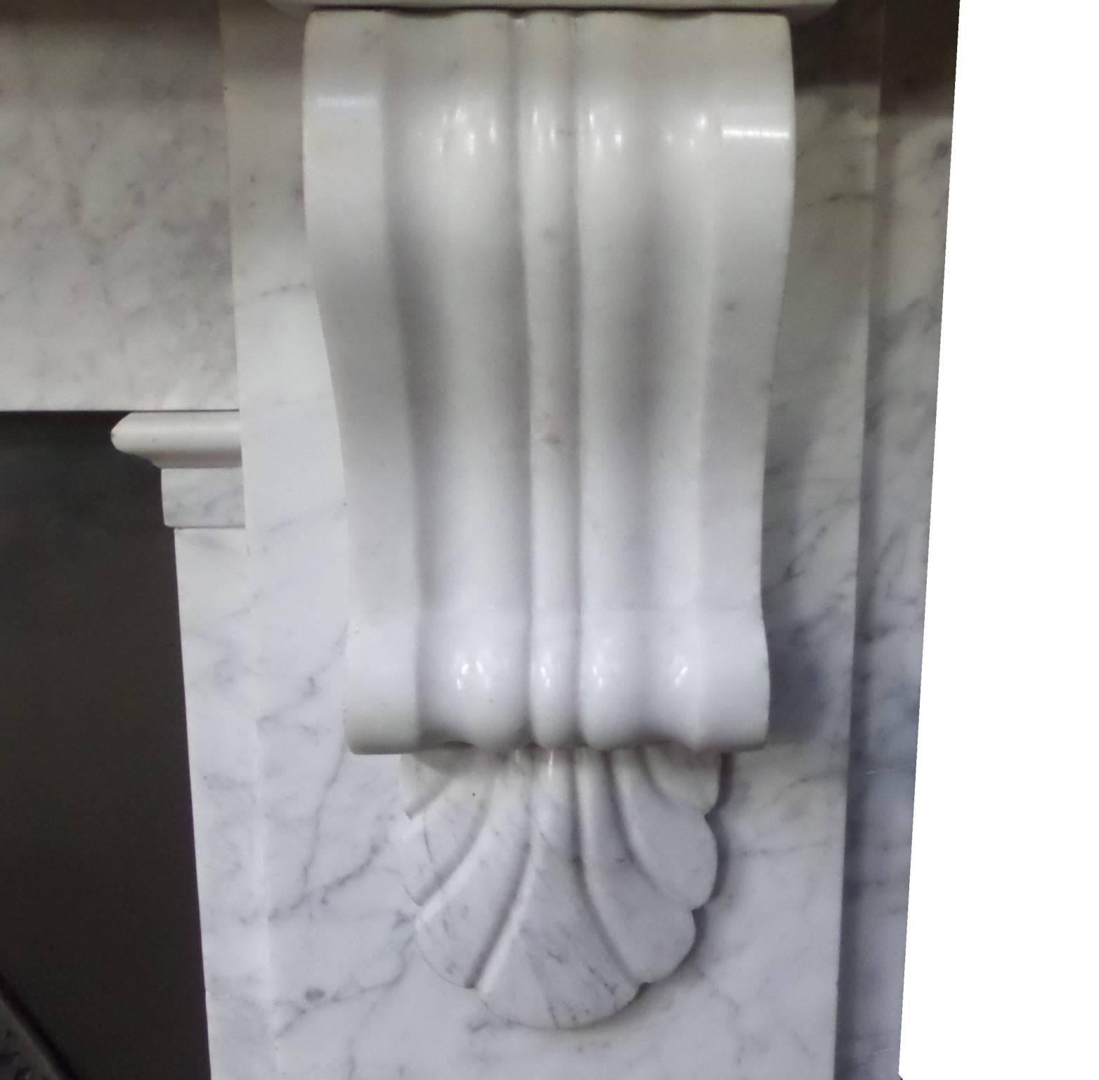 Antique restored 19th century Victorian Carrara marble surround with a shell corbel. The surround can be extended or reduced by width due to the cross piece design, circa 1860.