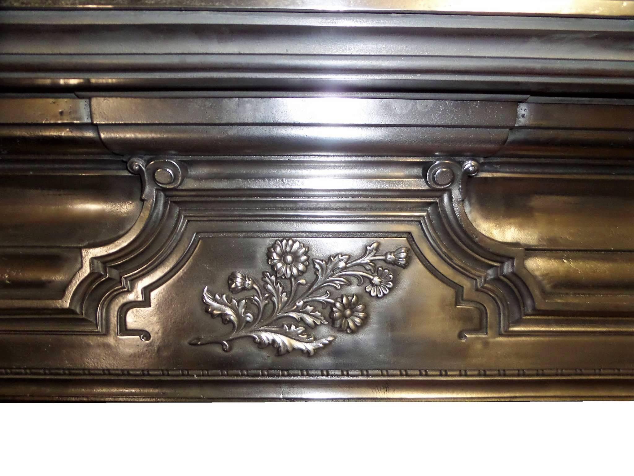 Antique restored large Edwardian burnished (semi polished) cast iron surround,
circa 1901. Beautiful cast detail with floral motif.