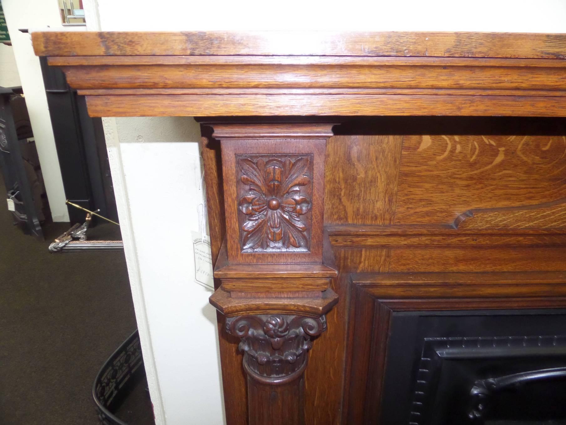 Antique restored 19th century Regency large English oak mantel / surround with handcrafted carved pillars and frieze.