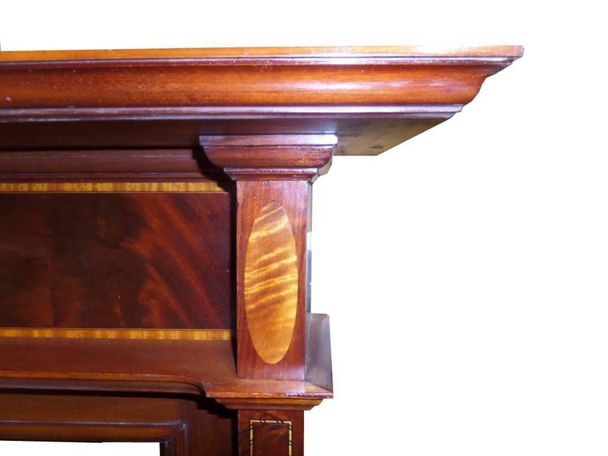Antique restored Edwardian mahogany Sheraton Revival mantel / surround. The surround is shown with an Edwardian tiled insert also available.