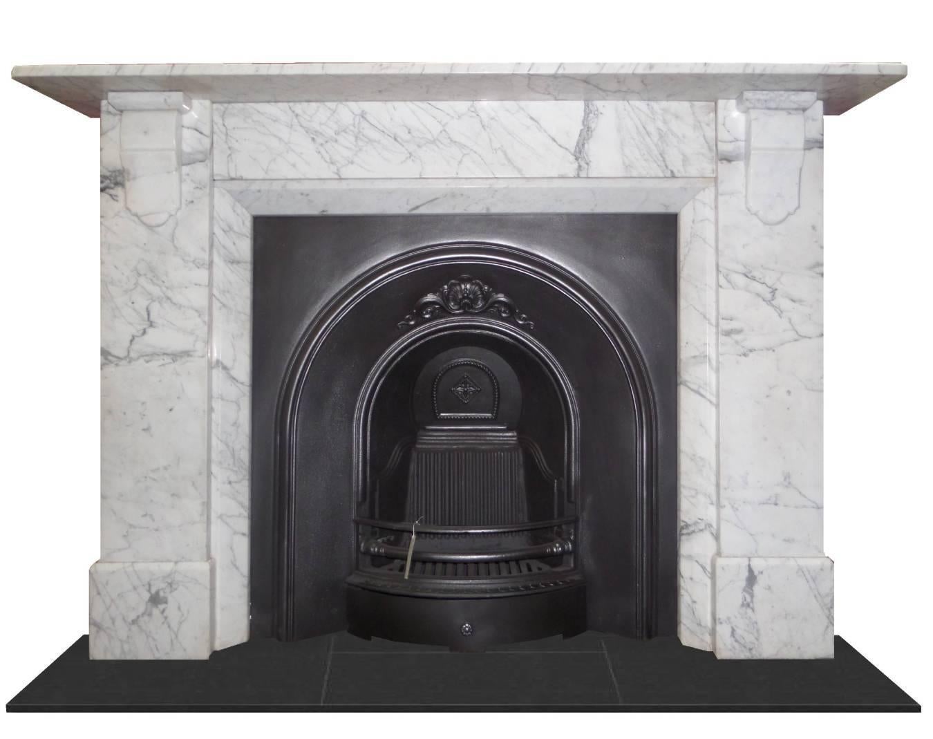 Antique restored Edwardian Carrara marble chimney piece. Shown with a traditional insert and a modern stove installation. The surround is colonial in design from the early 1900s and has been restored to a high standard. We now have video available