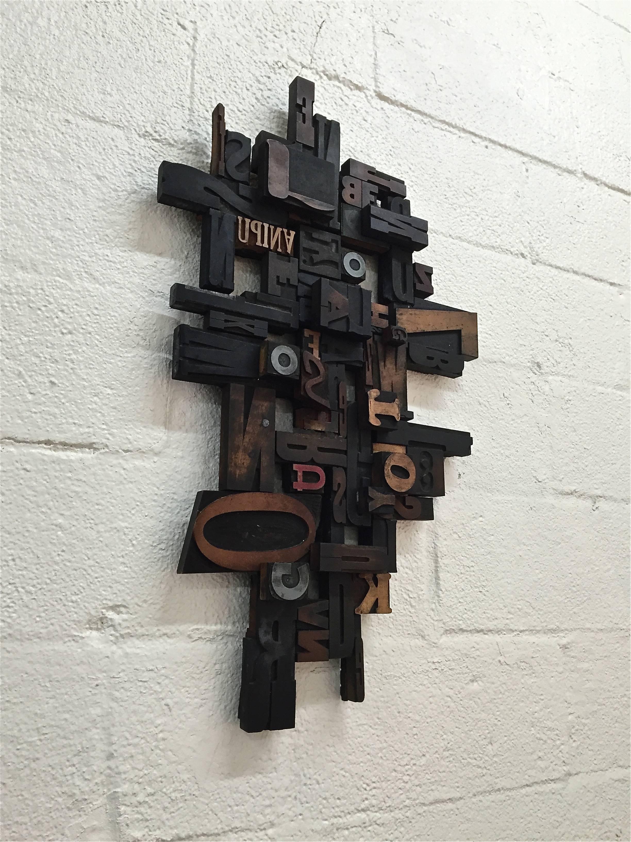 Mid-Century wood block wall sculpture. Signed by the artist on reverse, V. Jaspan, American, 1970s.