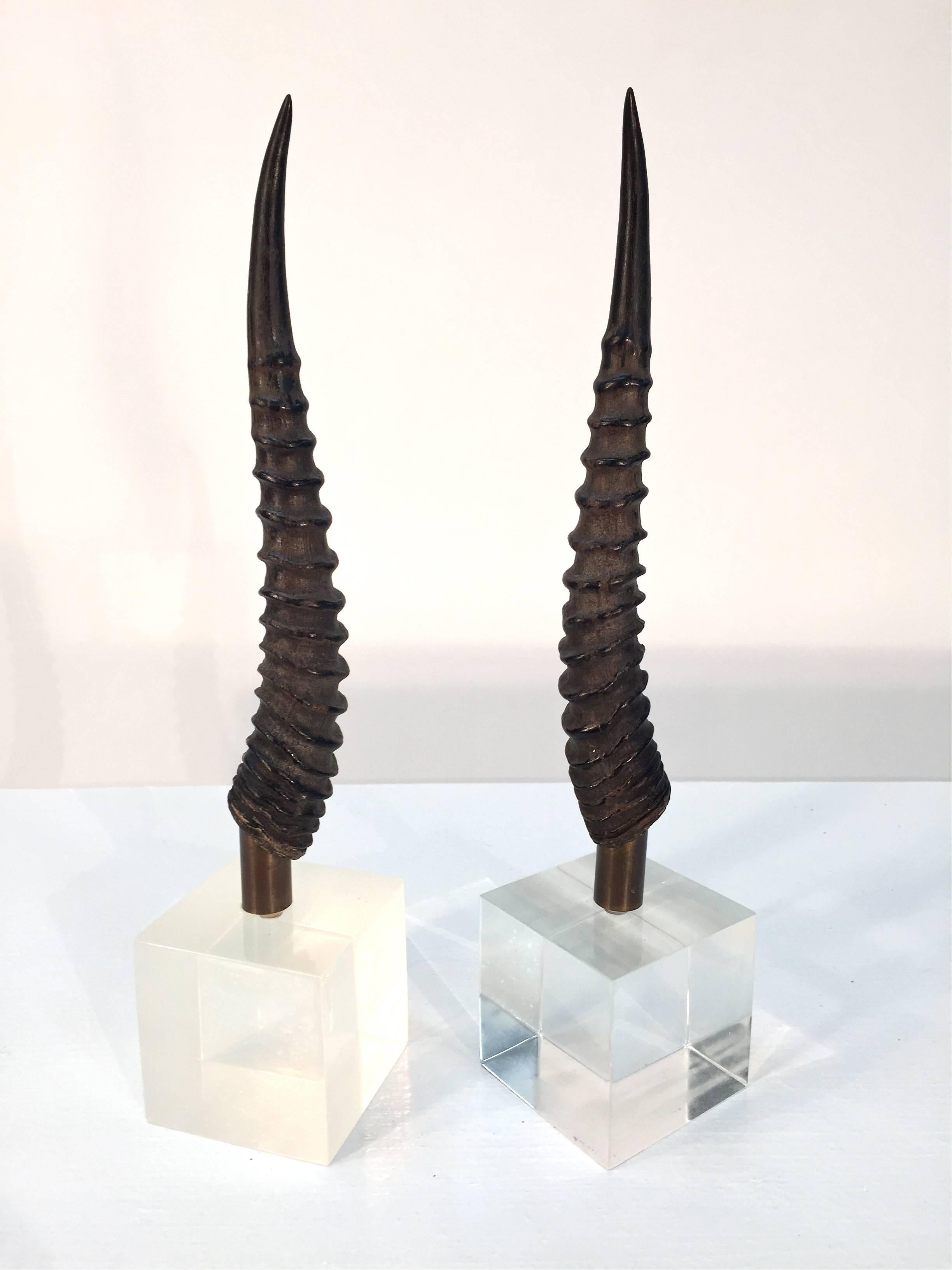 Pair of gazelle horns each mounted on a Lucite base.