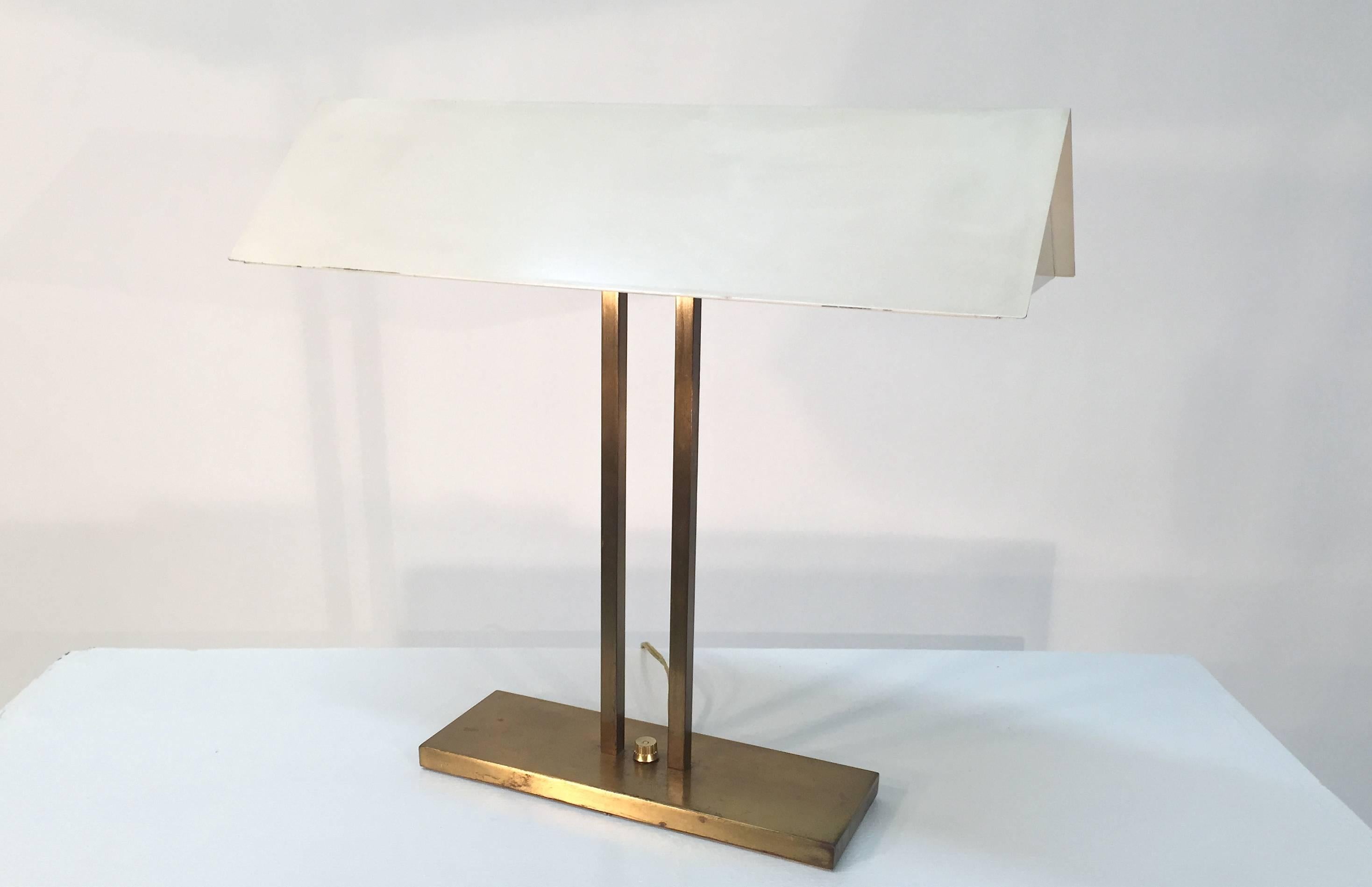 Greta Von Nessen desk lamp with a brass body and white enameled metal shade for Nessen New York, USA, 1960s.