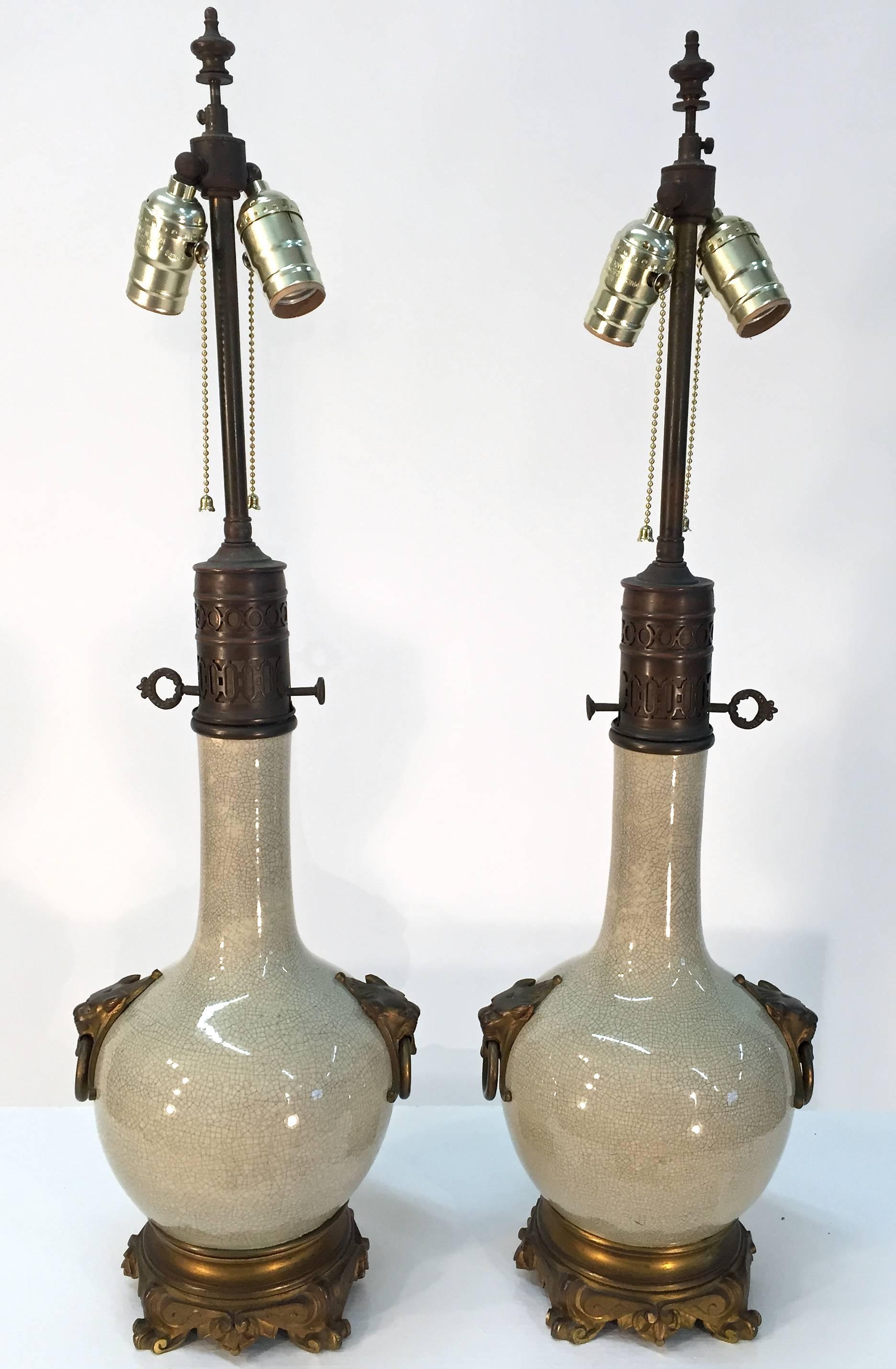 Pair of French, bronze-mounted crackle glaze ceramic table lamps from the late 19th century that were originally oil lamps.
