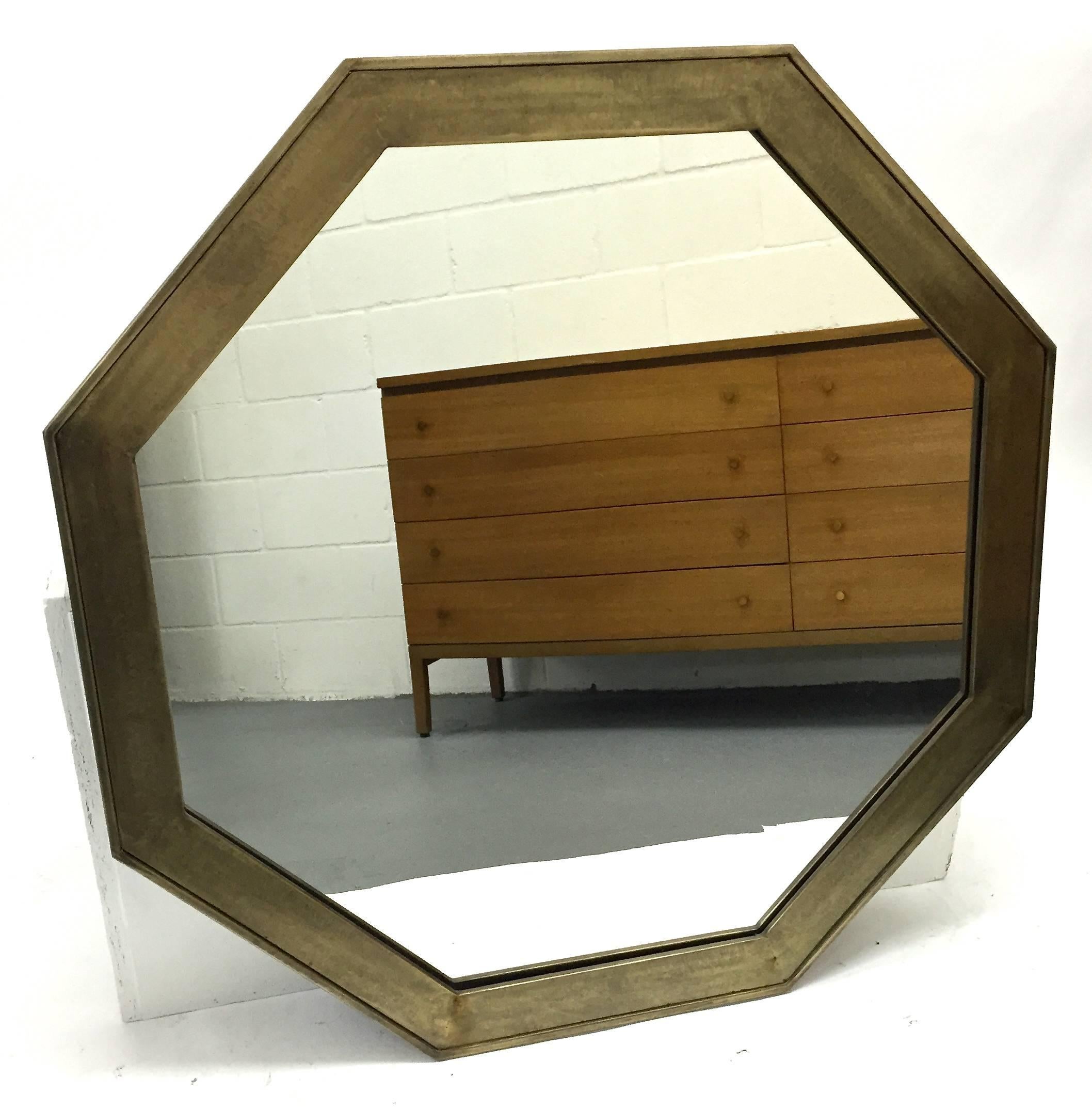 Brass octagonal wall mirror with a bronze patinated finish by John Widdicomb and retailed through John Stuart, Spain, 1960s.
