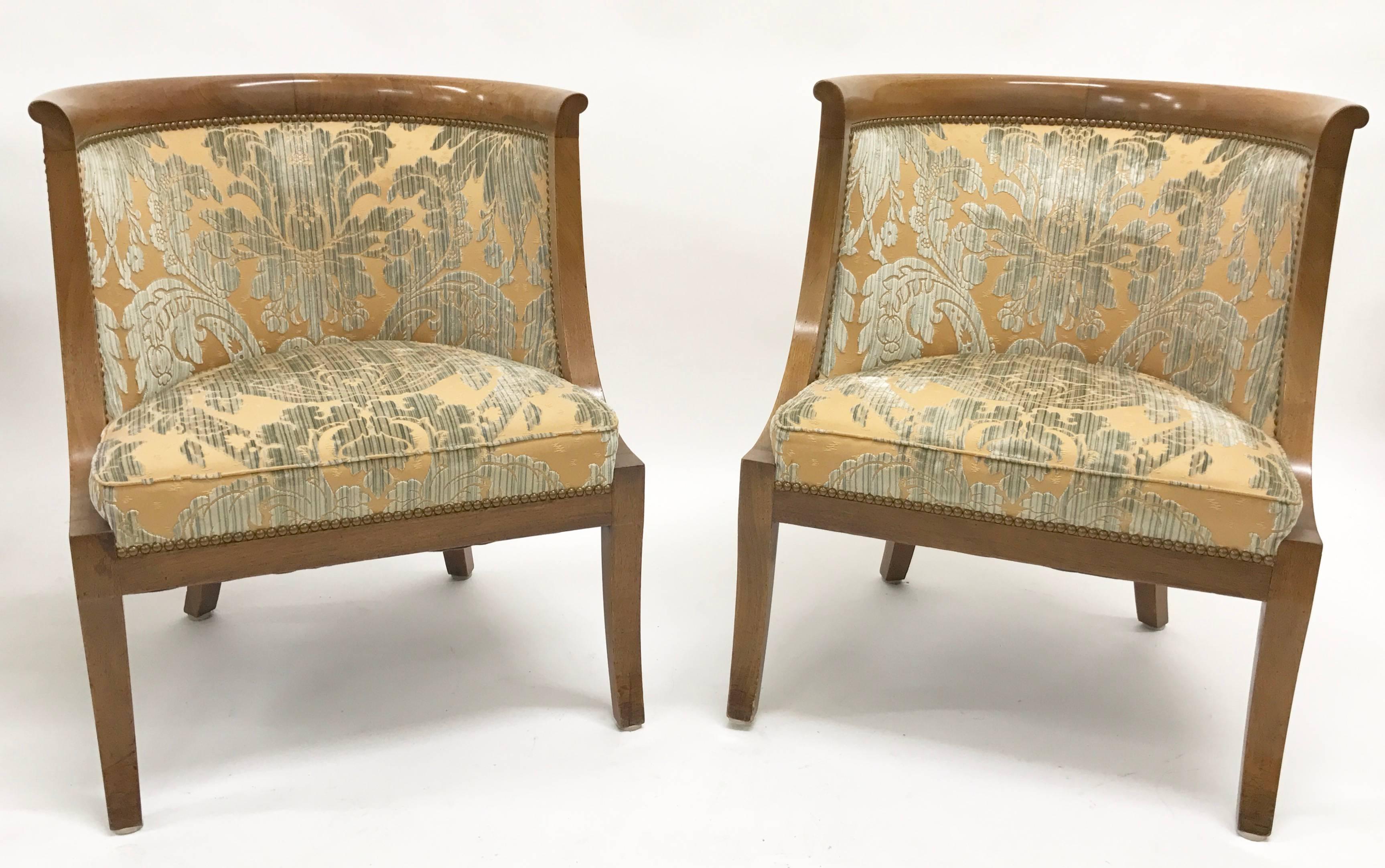 Pair of Biedermeier barrel-back tub chairs with ornate upholstery. These are a 1960s version of 19th century chairs.