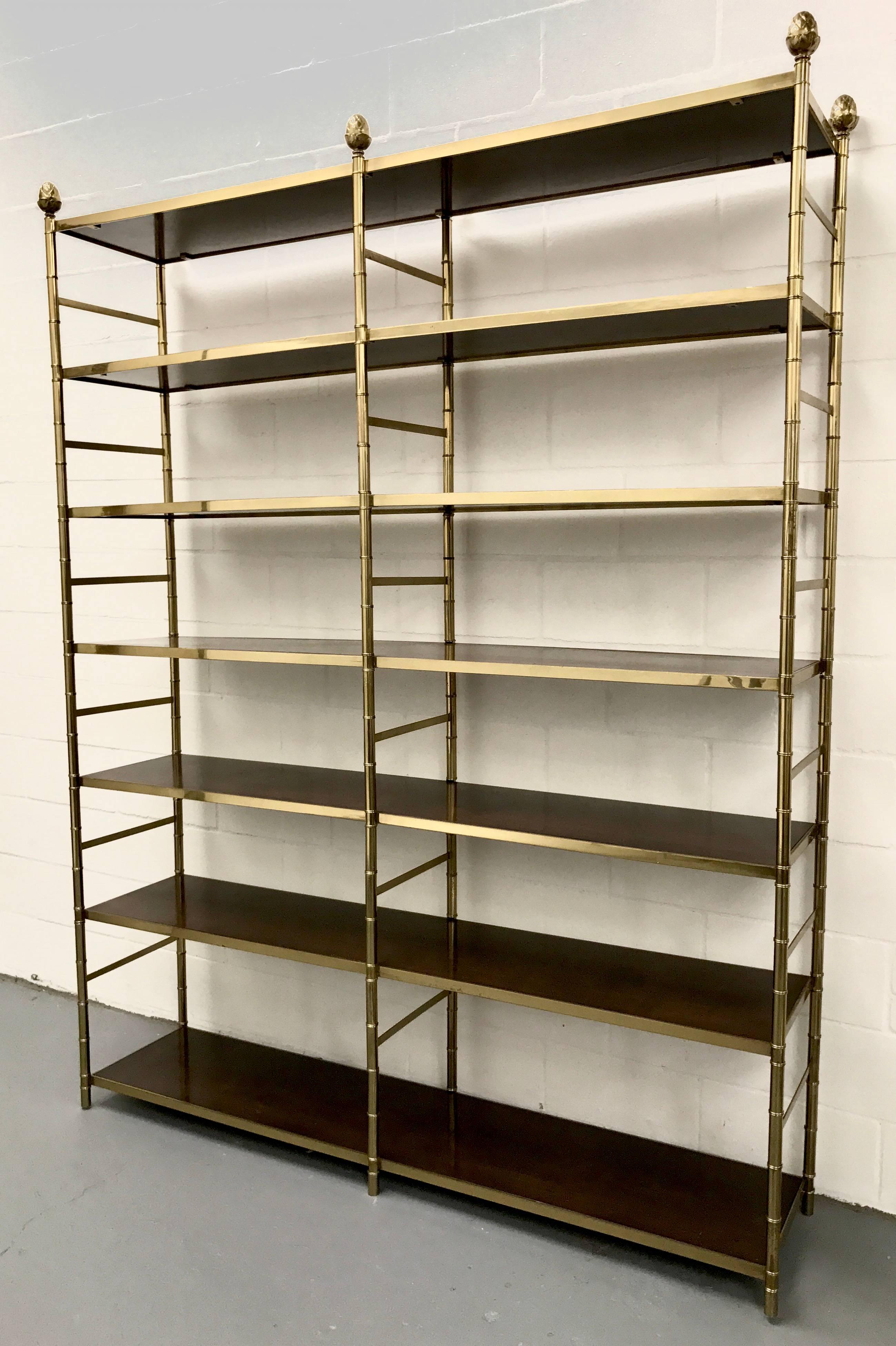 Large etagere with a solid brass tubular frame in a faux bamboo design, having elegant wood inset shelves, 1970s.