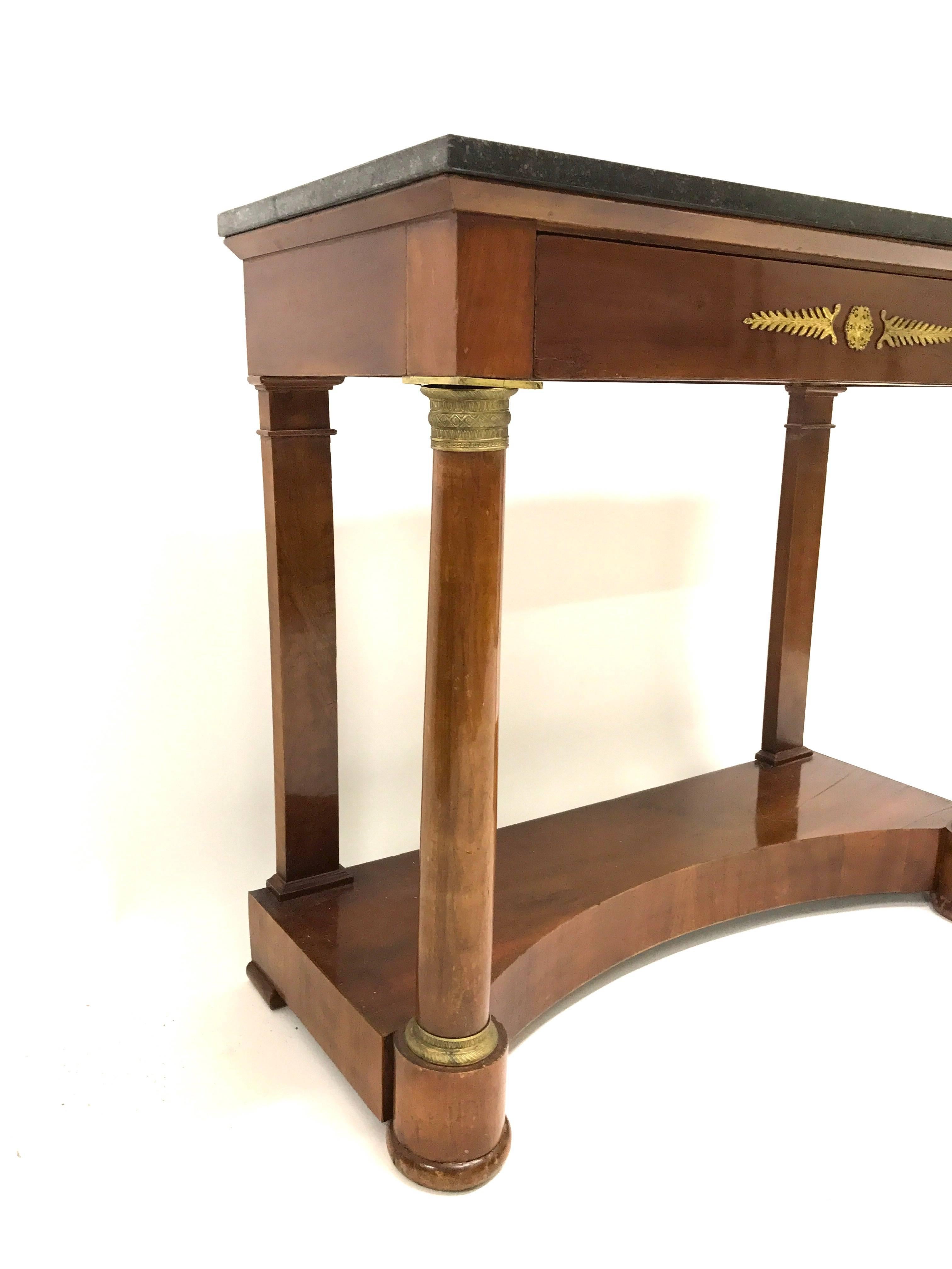 19th century French Empire console table with a marble top.