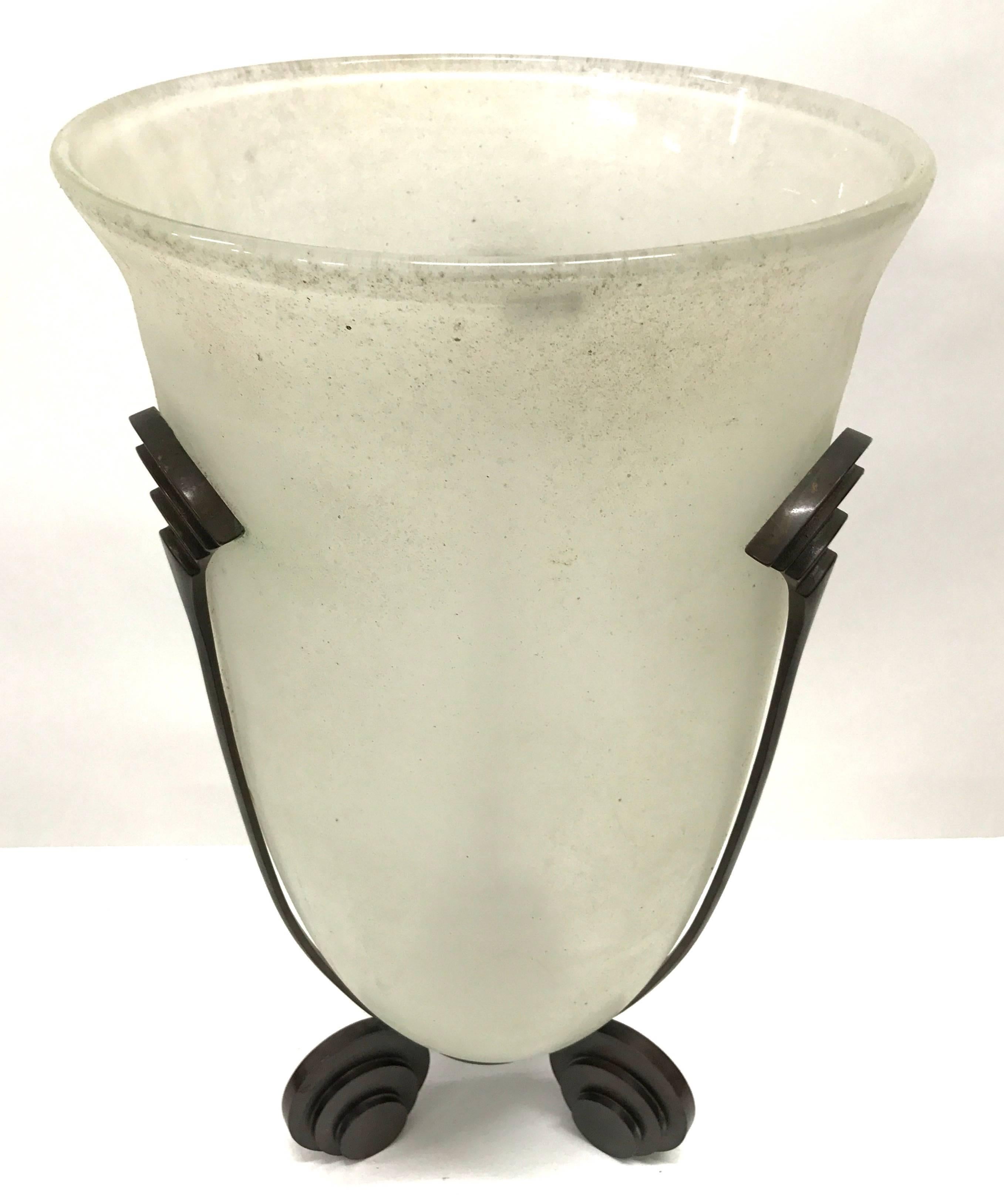 Monumental Seguso glass vase within a bronze stand by Karl Springer. Incised "Karl Springer" signature on the exterior bottom side of the glass vase, along with the Seguso label to the interior, 1980s