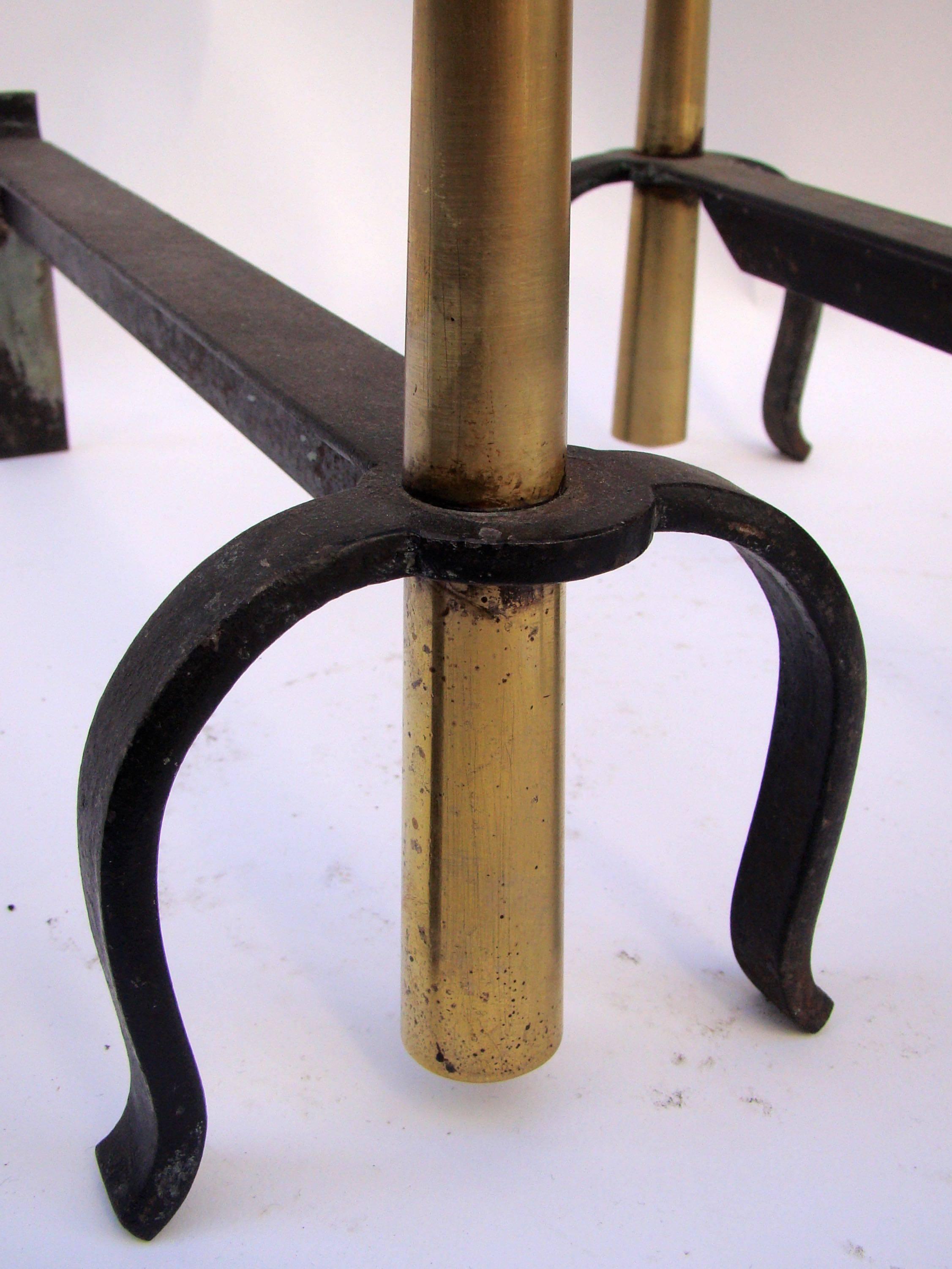 French 1950s-1960s Brass and Wrought Iron Pair of Andirons in the Style of Jean Royere