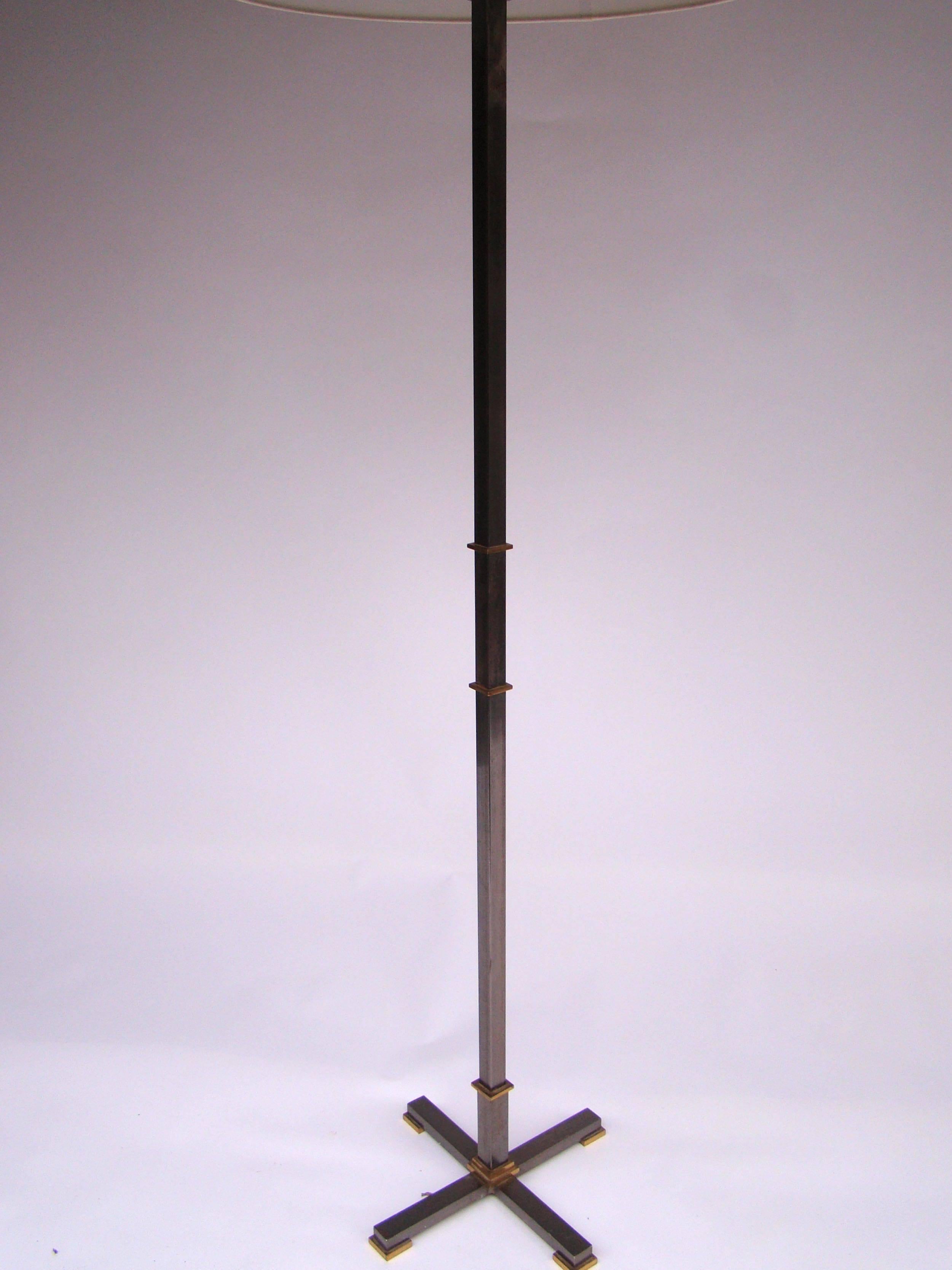 Handsome French floor lamp in steel and bronze by Maison Jansen, circa 1960.