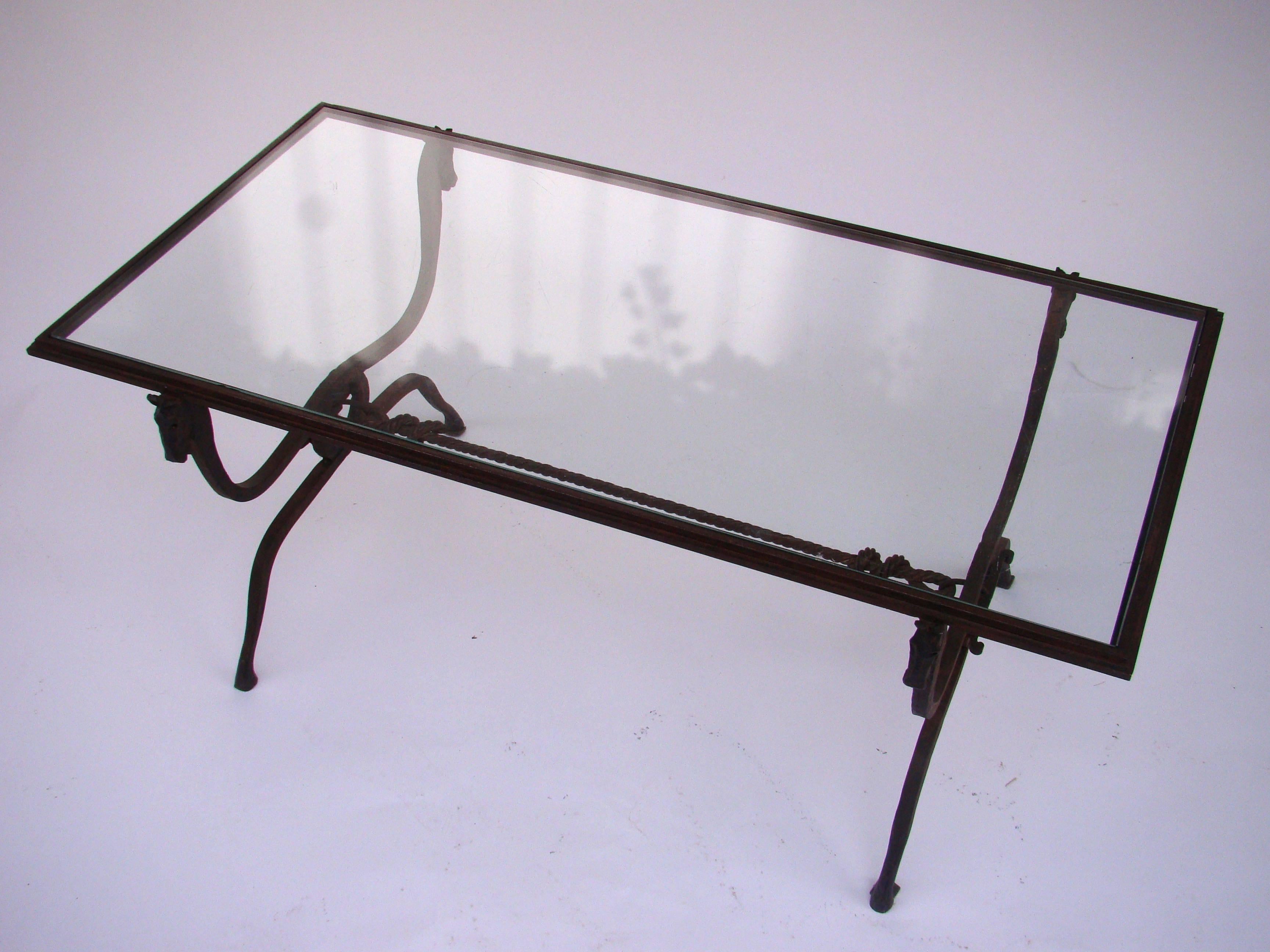 Handsome coffee table in wrought iron by Jean-Charles Moreux with a horse head and a rope features and a glass top, 1940s.