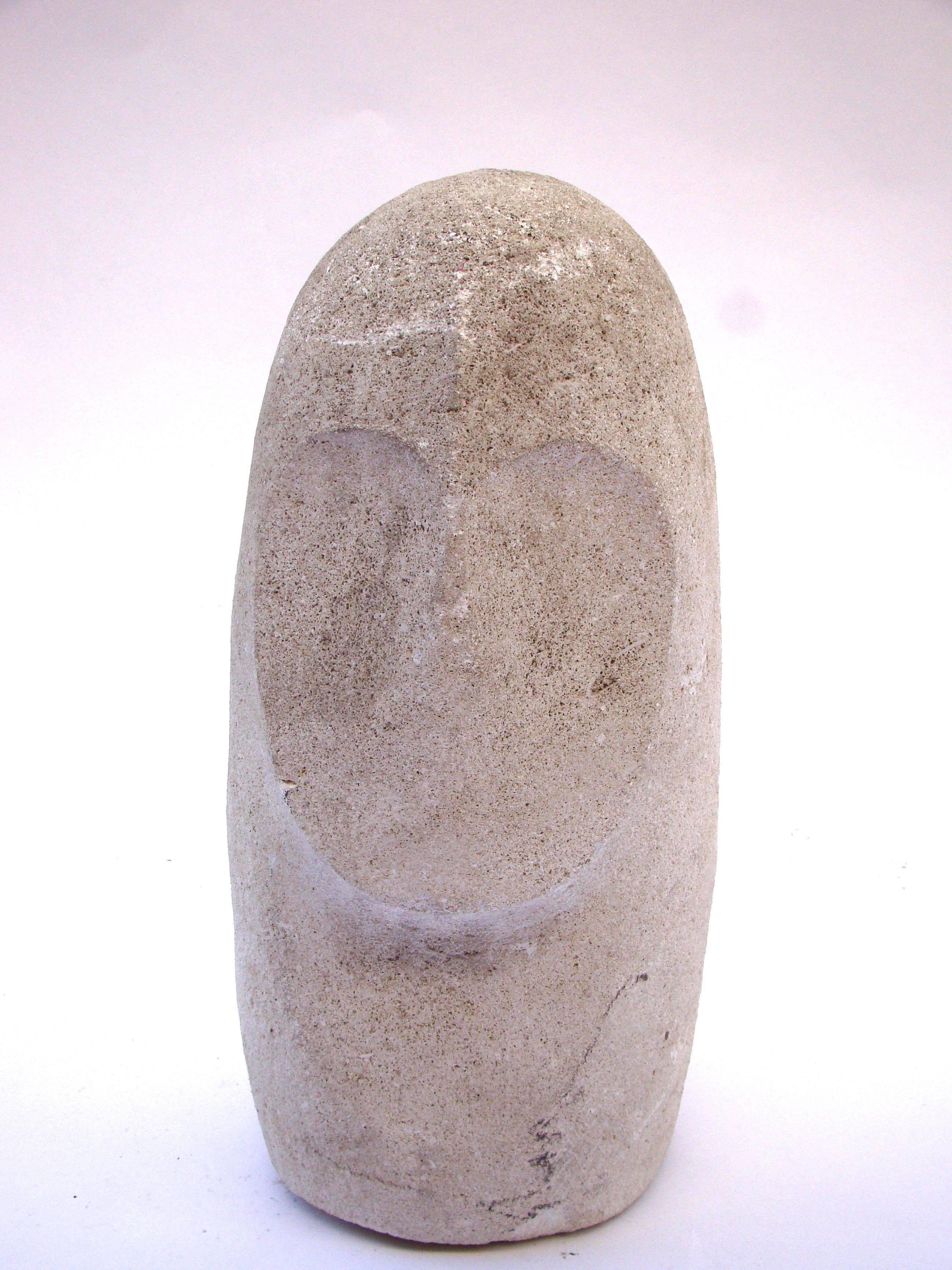 Original sculpture representing a Minimalist/abstract face in stone material, circa 1960-1970.