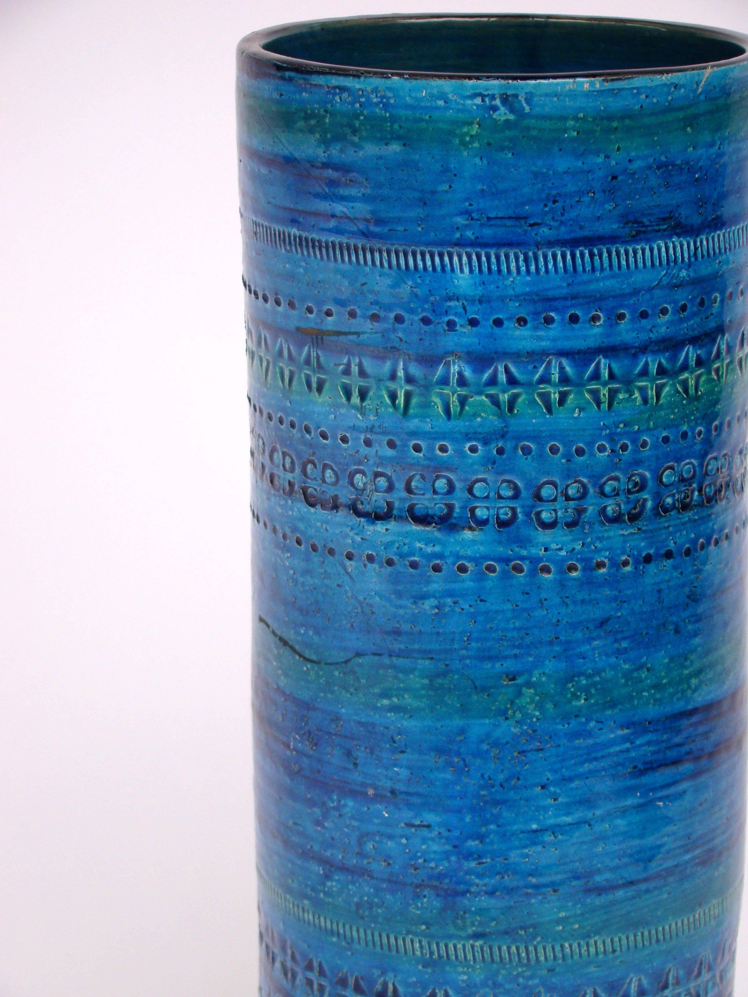 Handsome turquoise color vase designed by Bitossi's artistic director Aldo Londi in 1953, decorated with various striking geometric patterns running parallel on its surface.
 