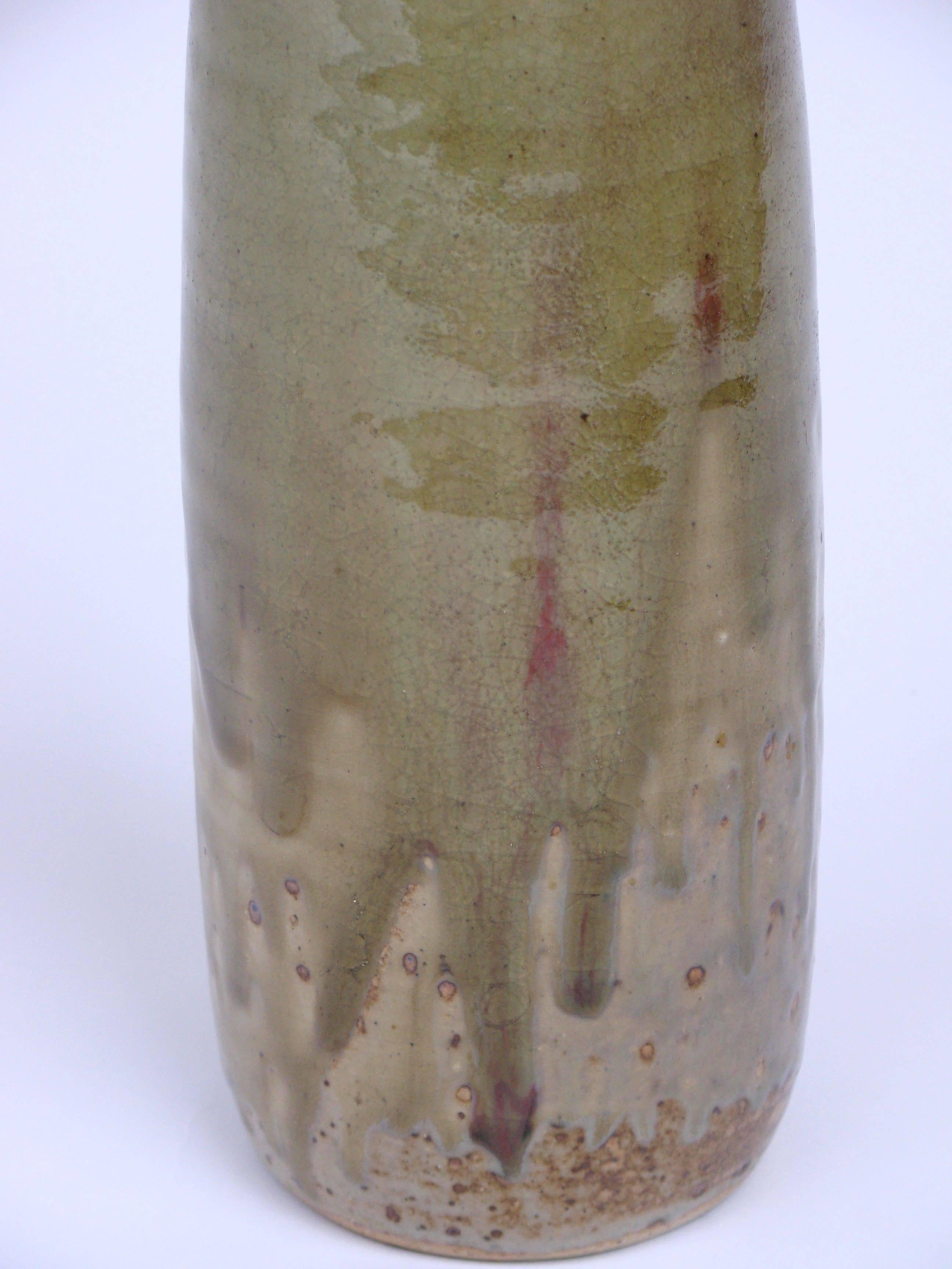 Short ceramic vase in green glaze, circa 1960.

Unknown signature.