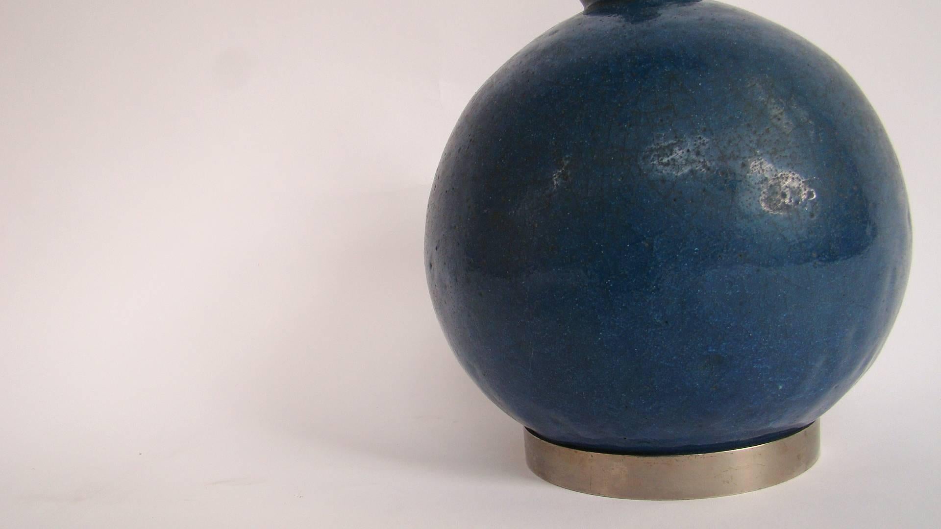 An elegant blue ceramic lamp by Raoul Lachenal. Handwritten signature under the base 