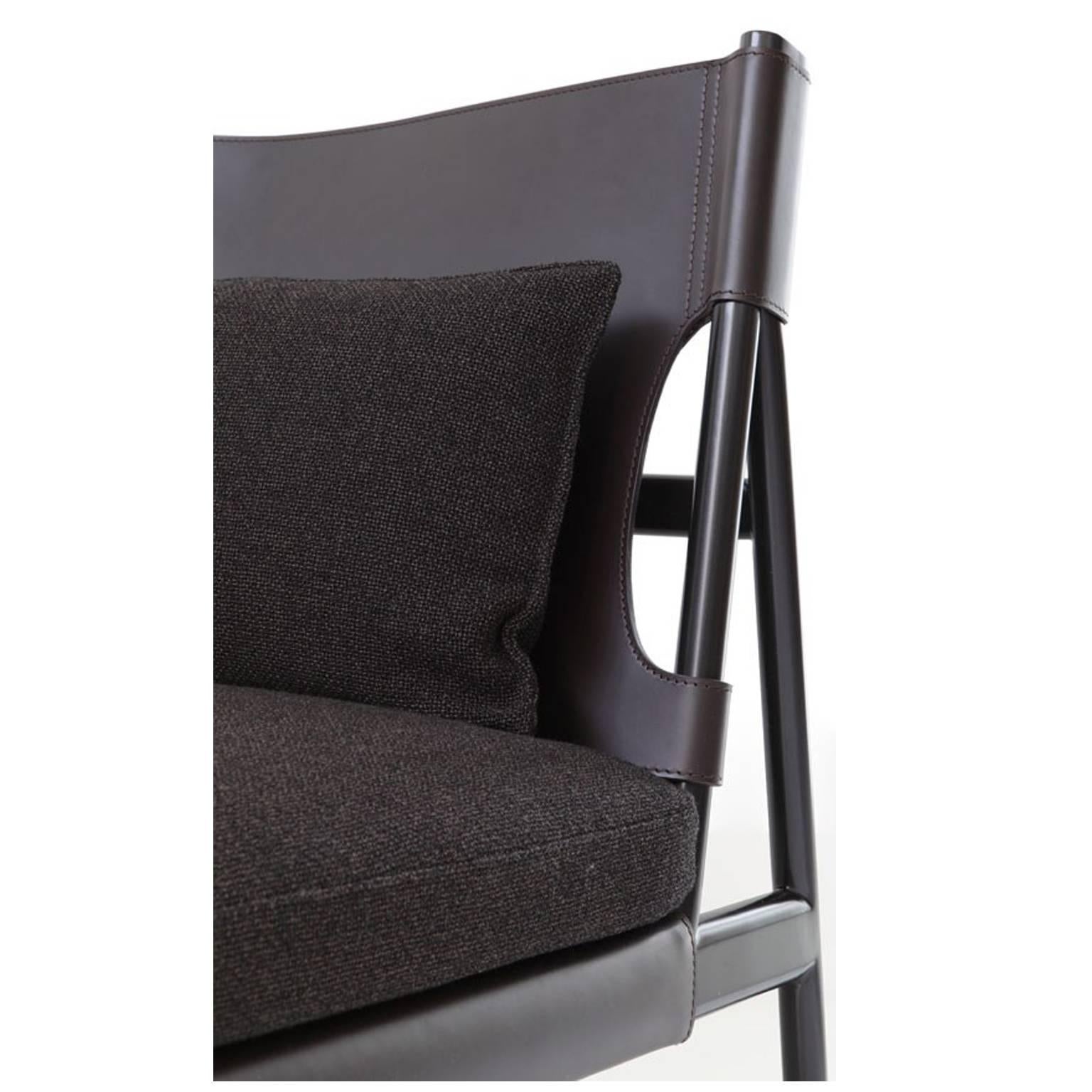 Black varnished metal structure covered in black saddled leather with seat and toss pillows in fully removable fabric covers, available from showroom display. 
Dimensions: 75