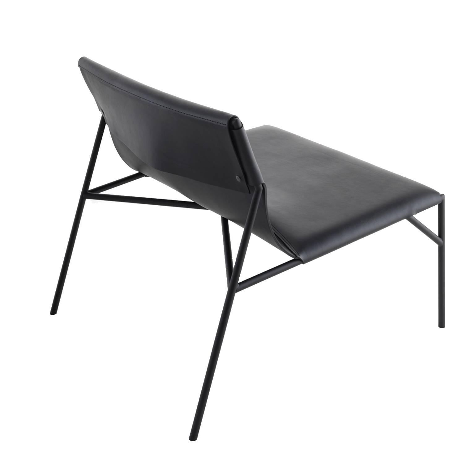 Steel structure with rubberized finish wrapped in black saddle leather, available from showroom display. 
Dimensions: 30 1/2