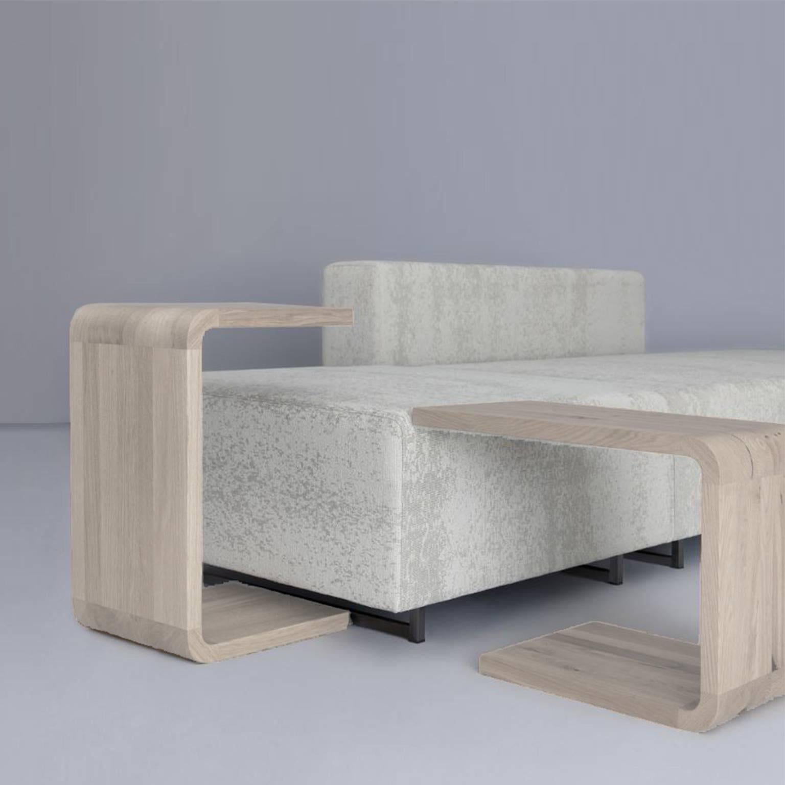Set of x2 nesting side tables available from showroom display in solid oak stained chalk white from sample display. These tables nest neatly within each other creating an interesting composition, though can be easily placed over sofa armrests or